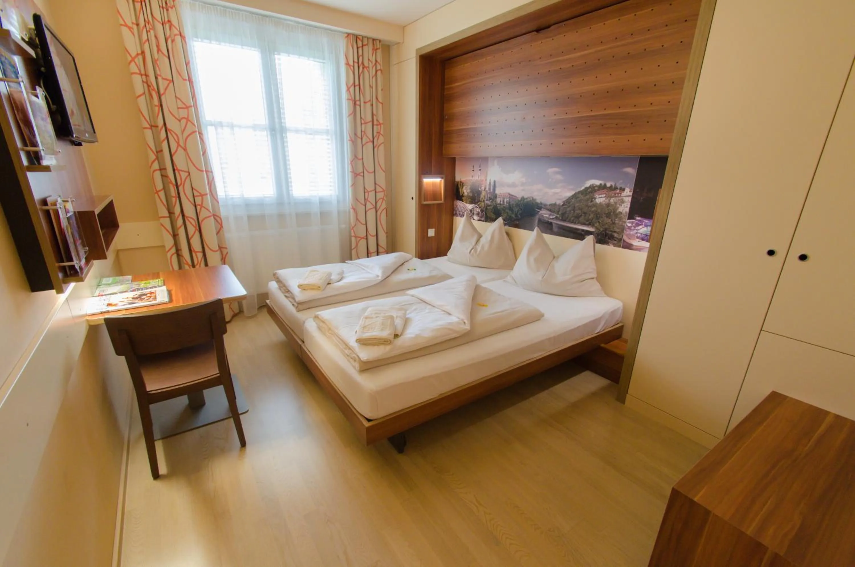 Photo of the whole room, Bed in JUFA Hotel Graz City