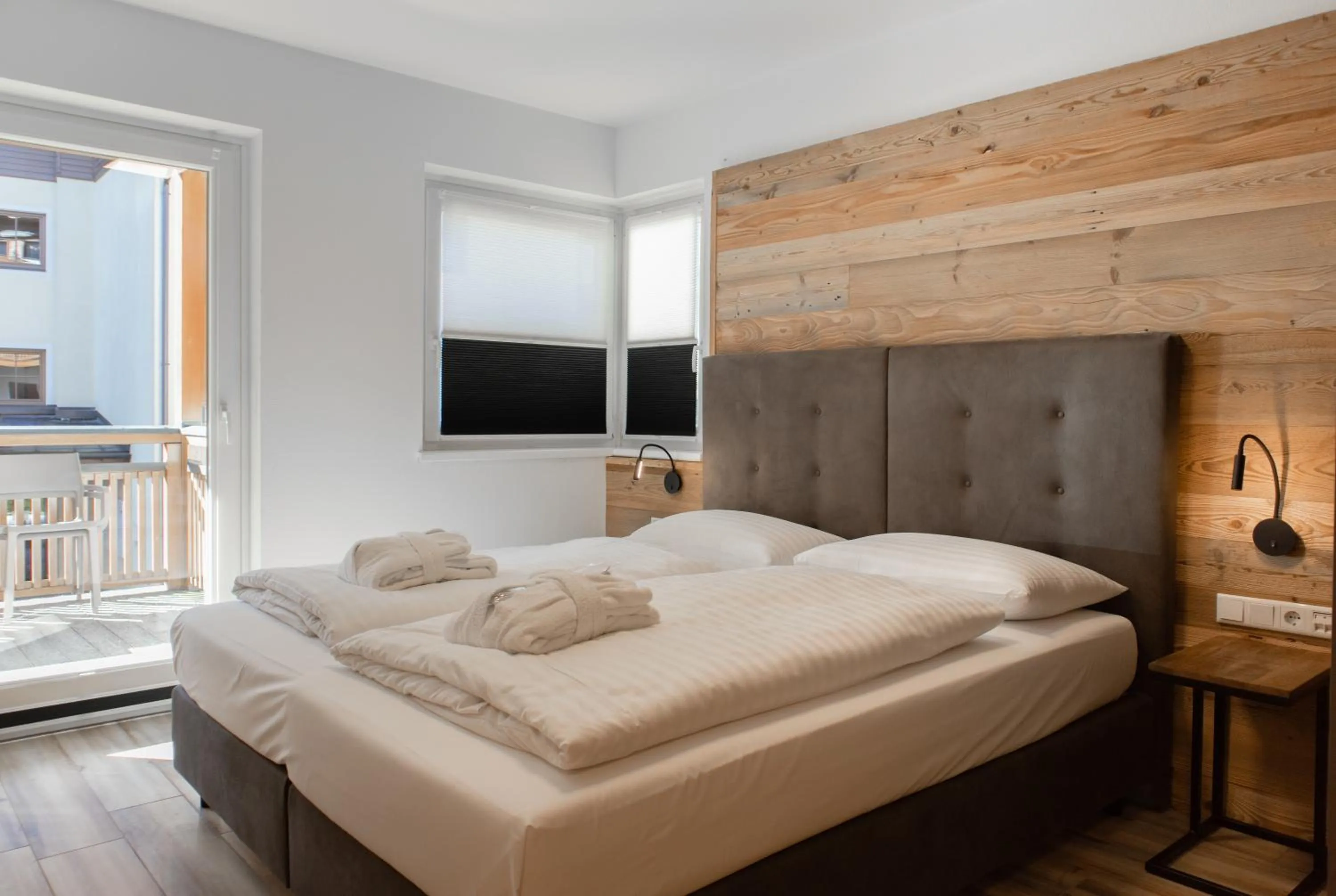 Bed in AvenidA Style Appartements by Alpin Rentals