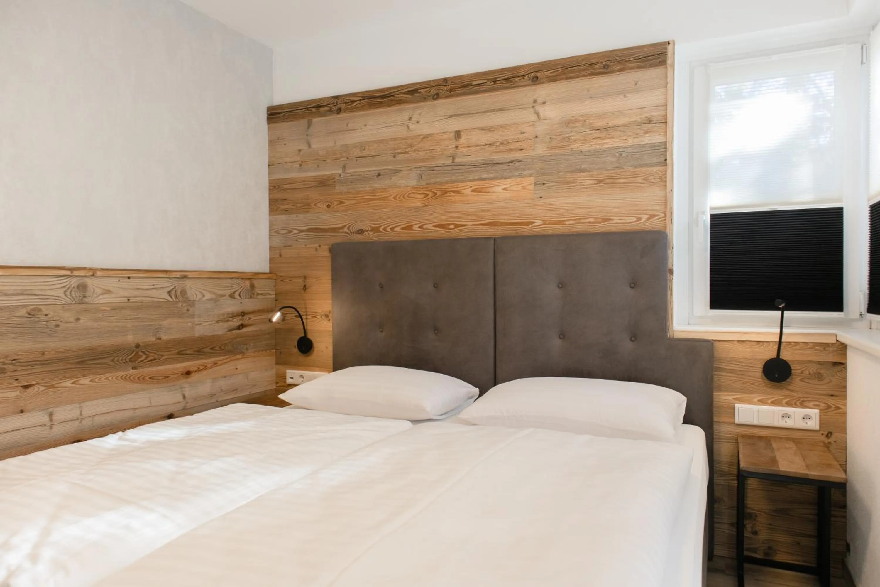 Bed in AvenidA Style Appartements by Alpin Rentals