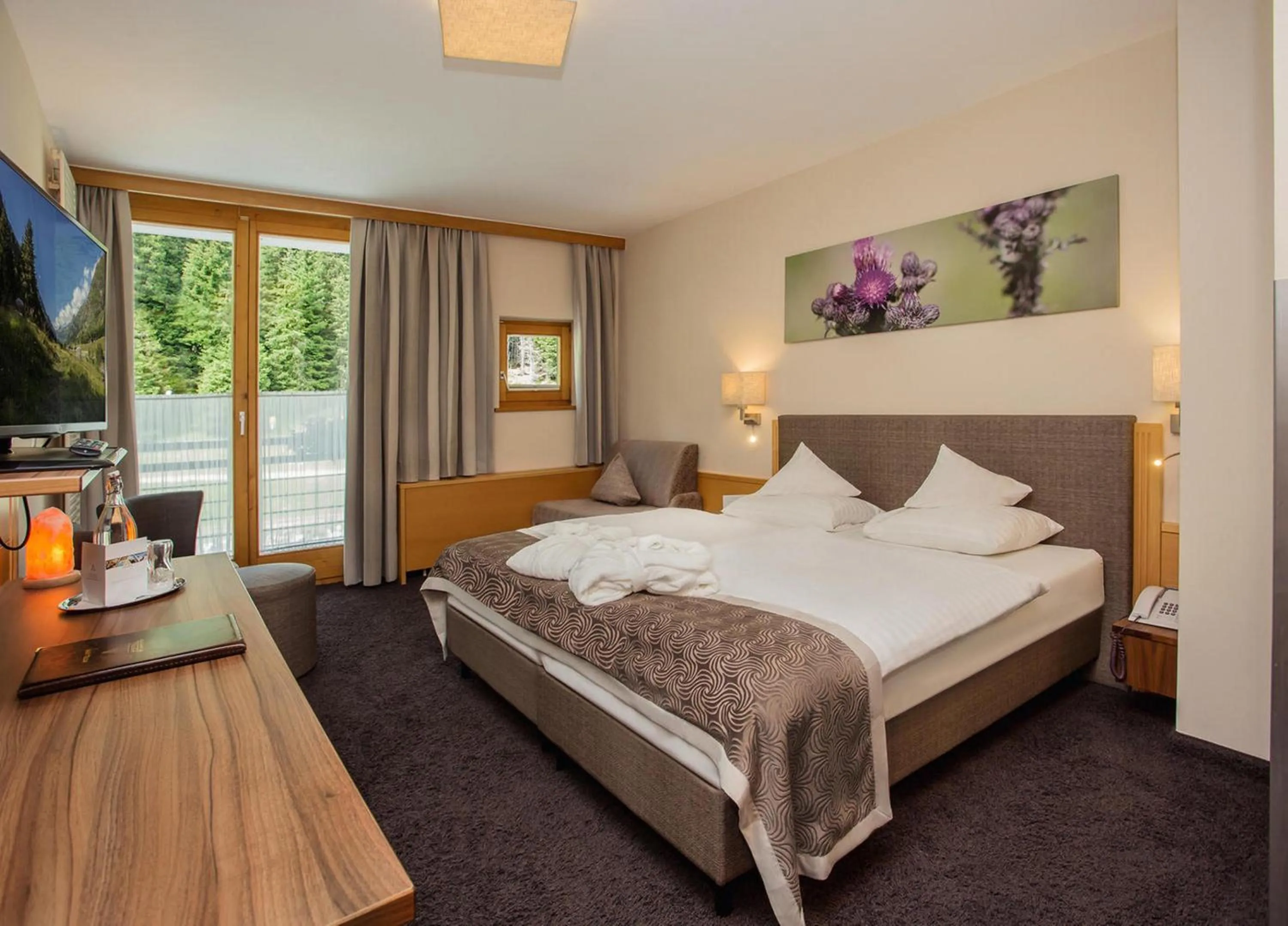 Photo of the whole room, Bed in DAS VIER Sport,- und Wellnesshotel