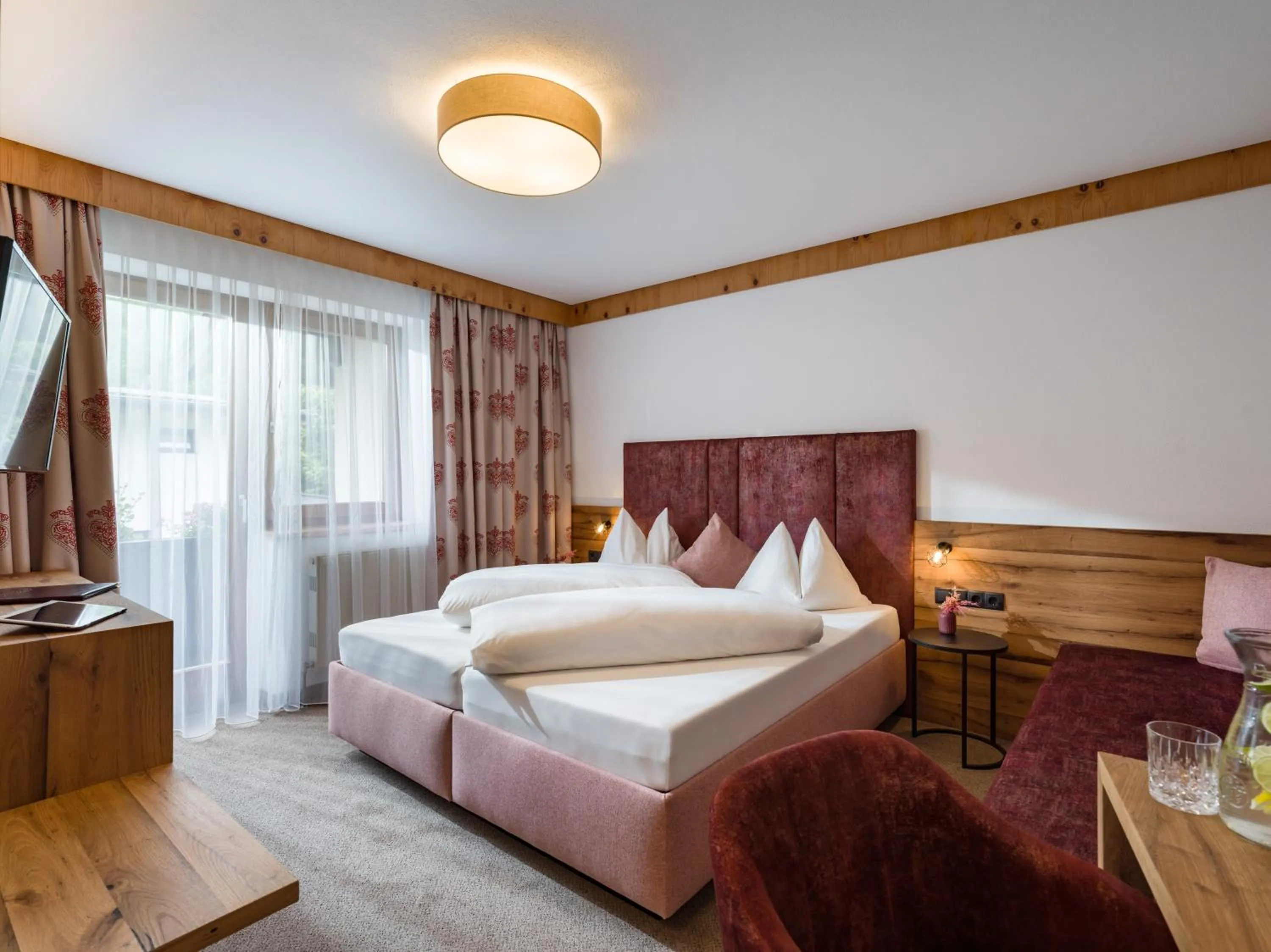 Photo of the whole room, Bed in Hotel Landhaus Zillertal