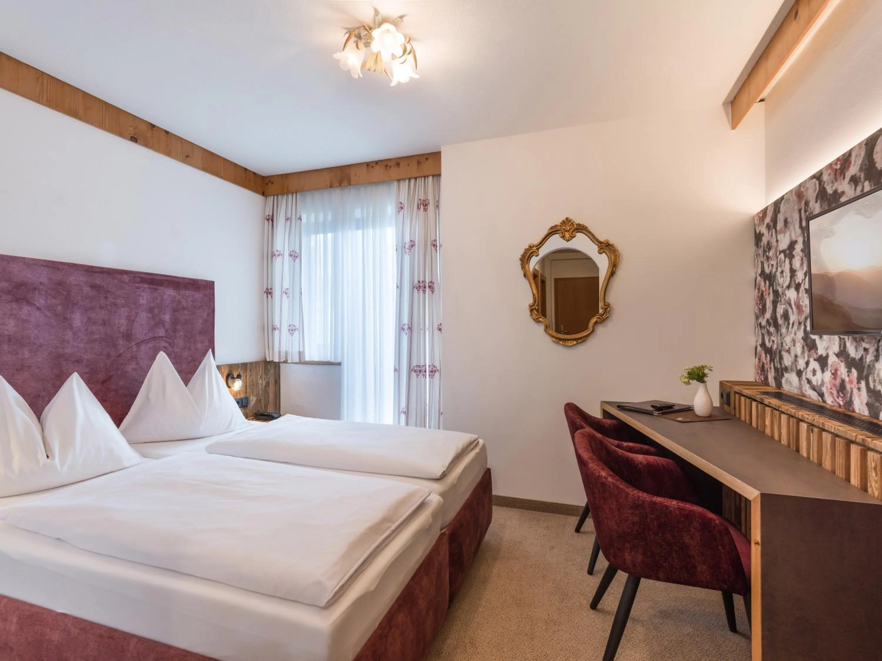 Photo of the whole room, Bed in Hotel Landhaus Zillertal