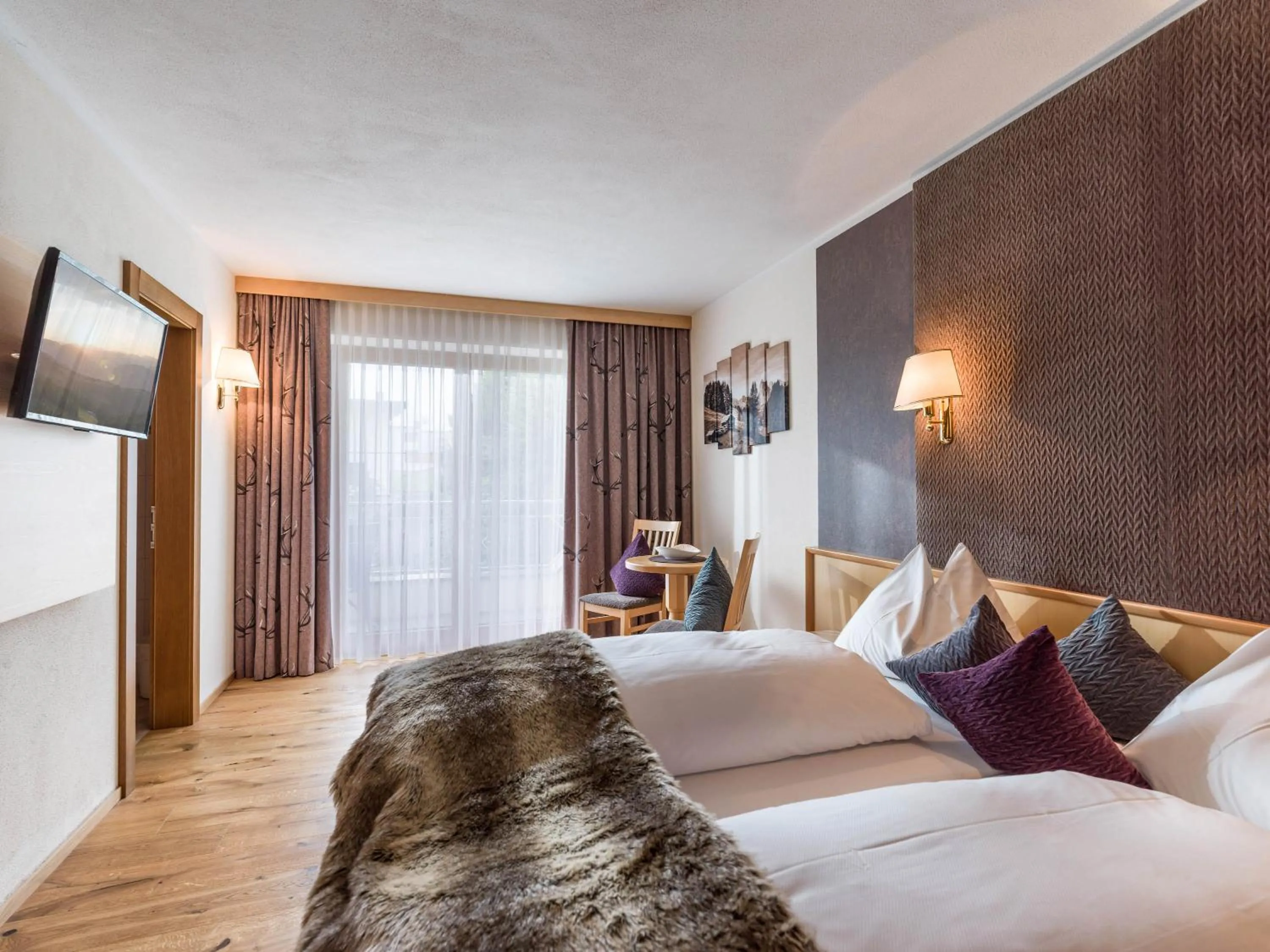 Photo of the whole room, Bed in Hotel Landhaus Zillertal