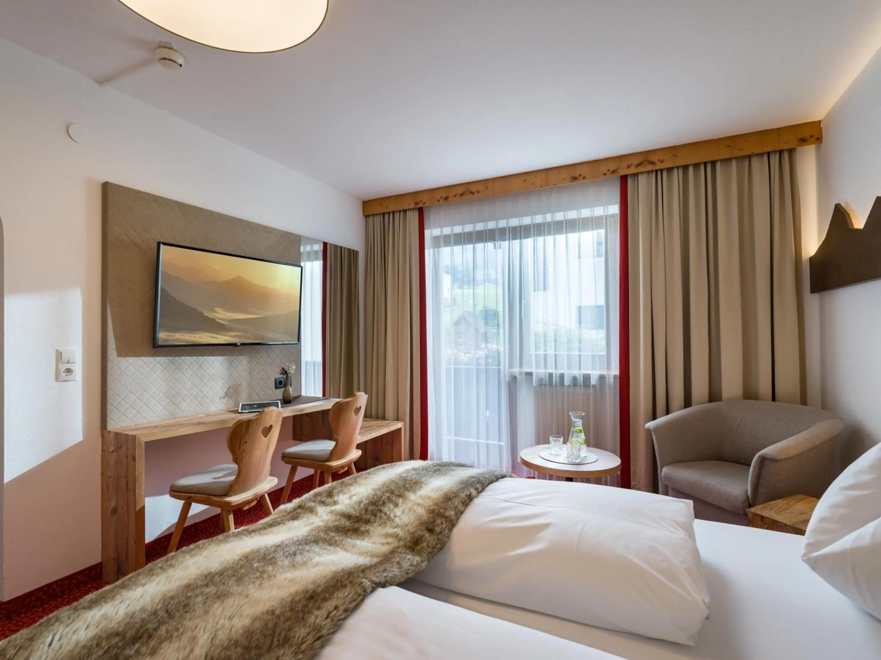 Photo of the whole room, Bed in Hotel Landhaus Zillertal