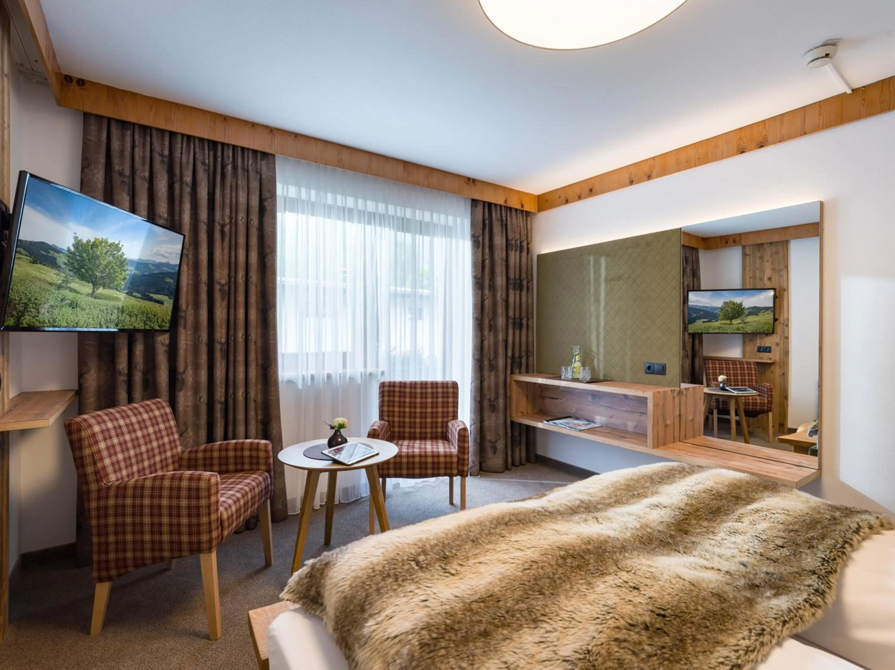 Photo of the whole room, Bed in Hotel Landhaus Zillertal