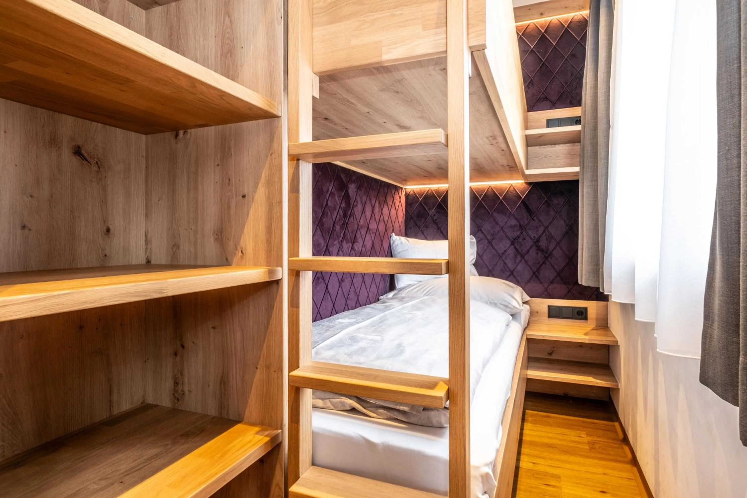 Bed in Dorfkrug Kaprun - Luxury Suites & Appartements