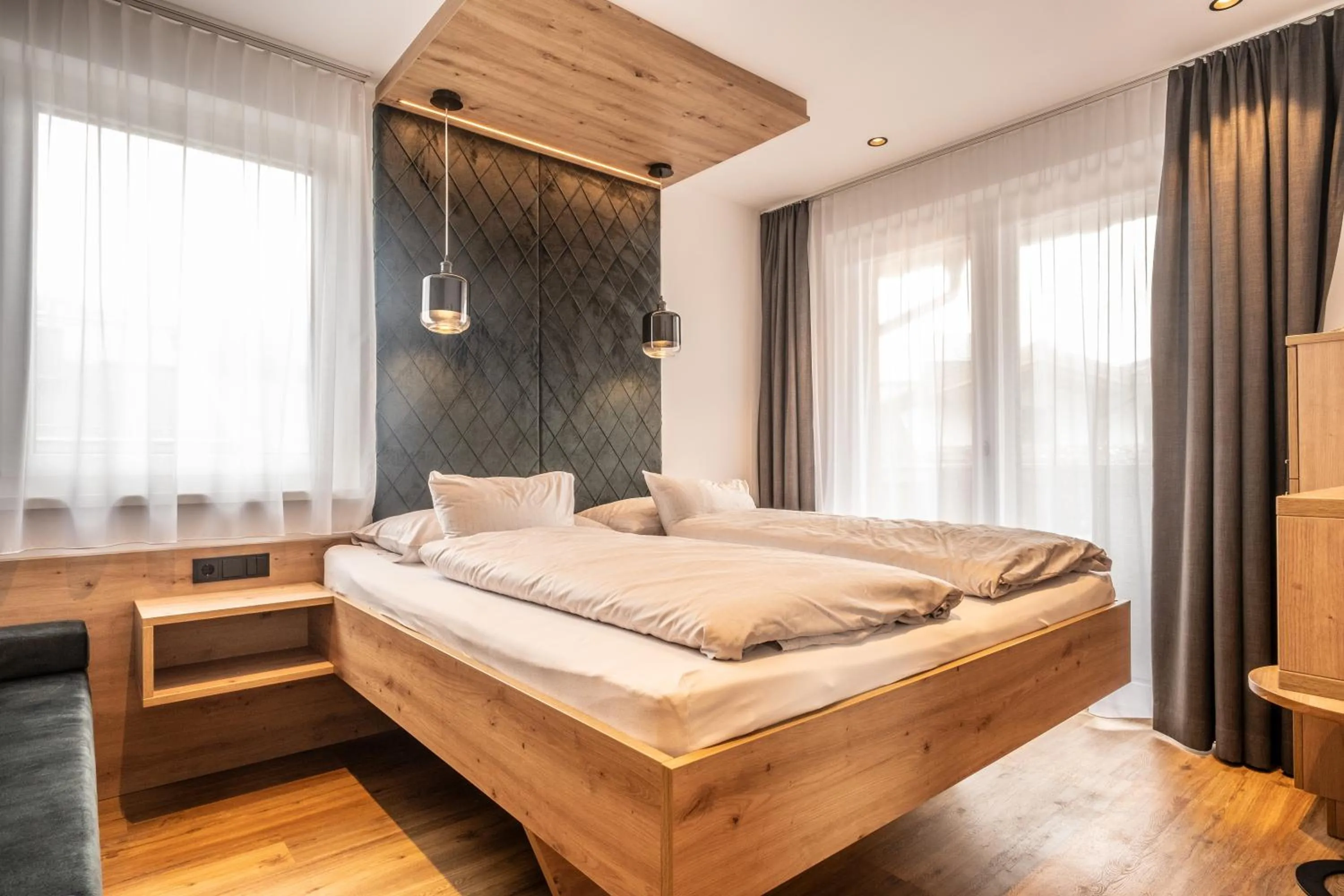 Bed in Dorfkrug Kaprun - Luxury Suites & Appartements