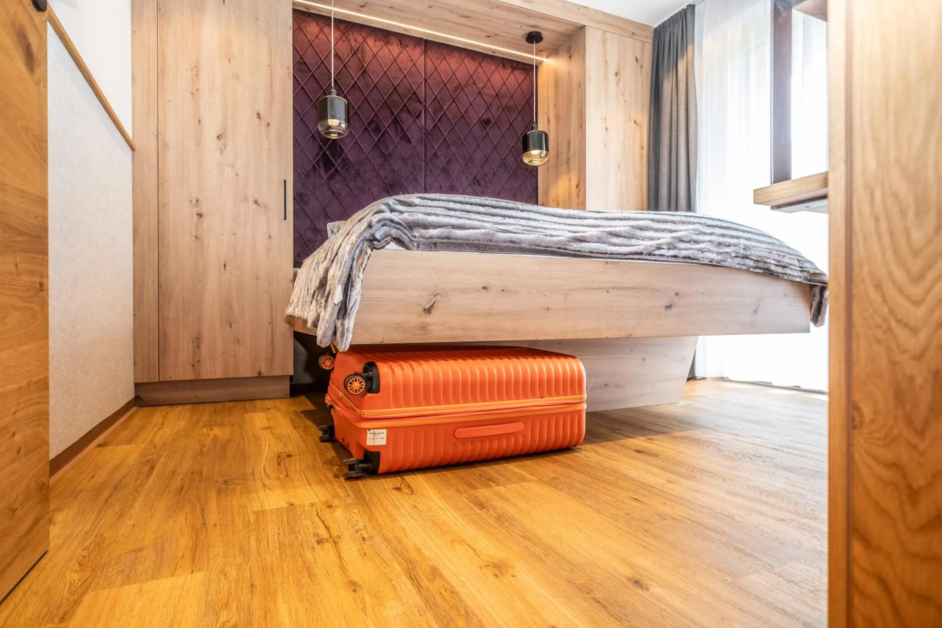 Bed in Dorfkrug Kaprun - Luxury Suites & Appartements