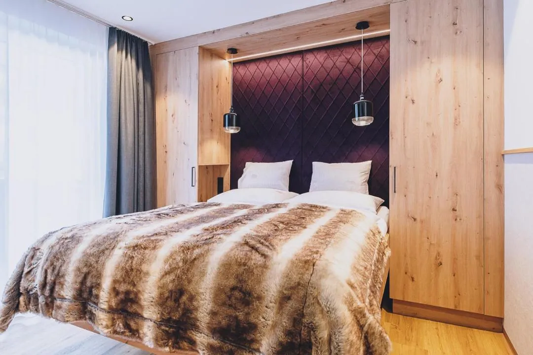 Bed in Dorfkrug Kaprun - Luxury Suites & Appartements