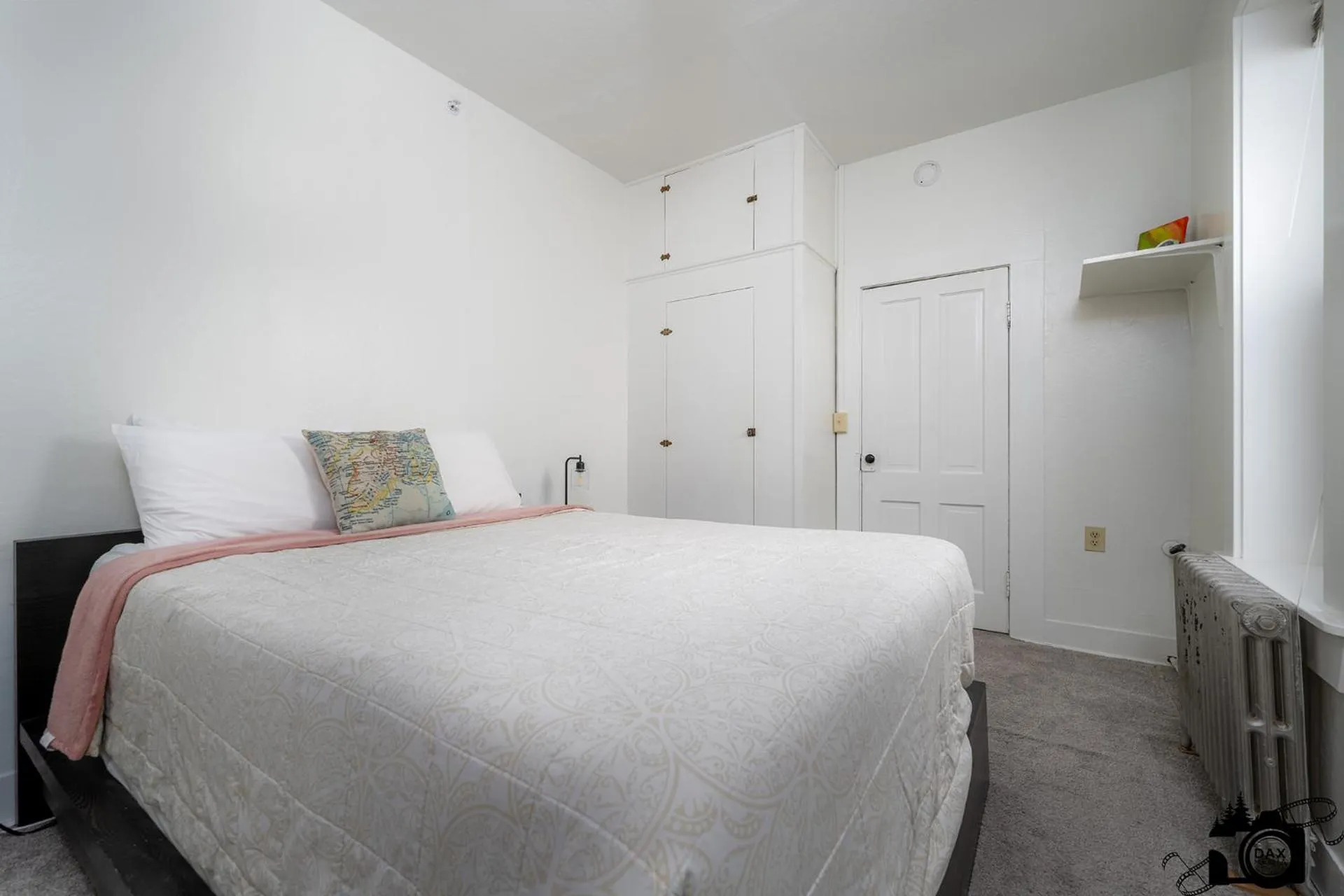 Bed in Brown & Hawkins Historical Apartments