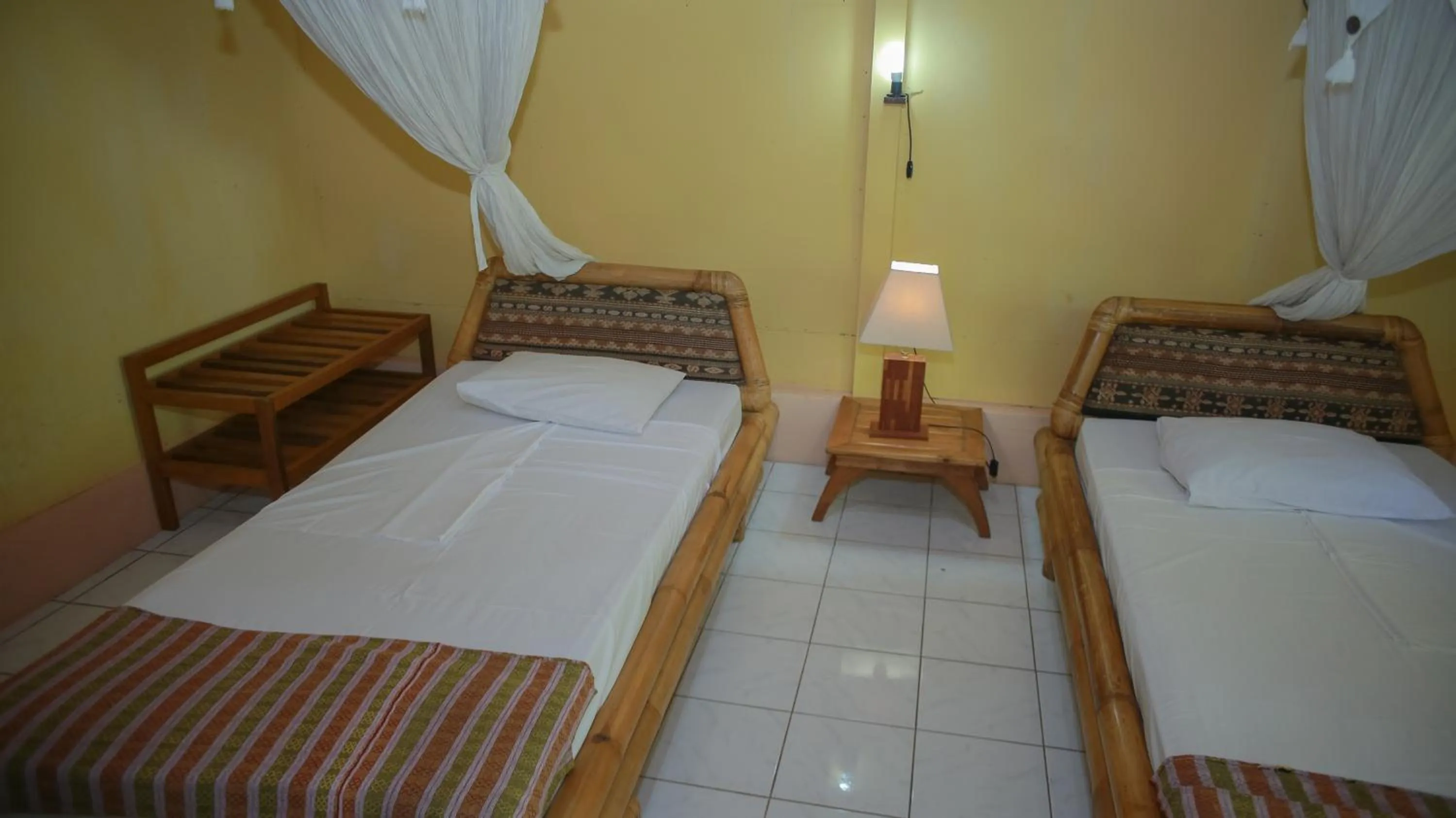 Bed in Sea World Club Beach Resort & Dive Center, RESORT THAT SUPPORTS THE POOR