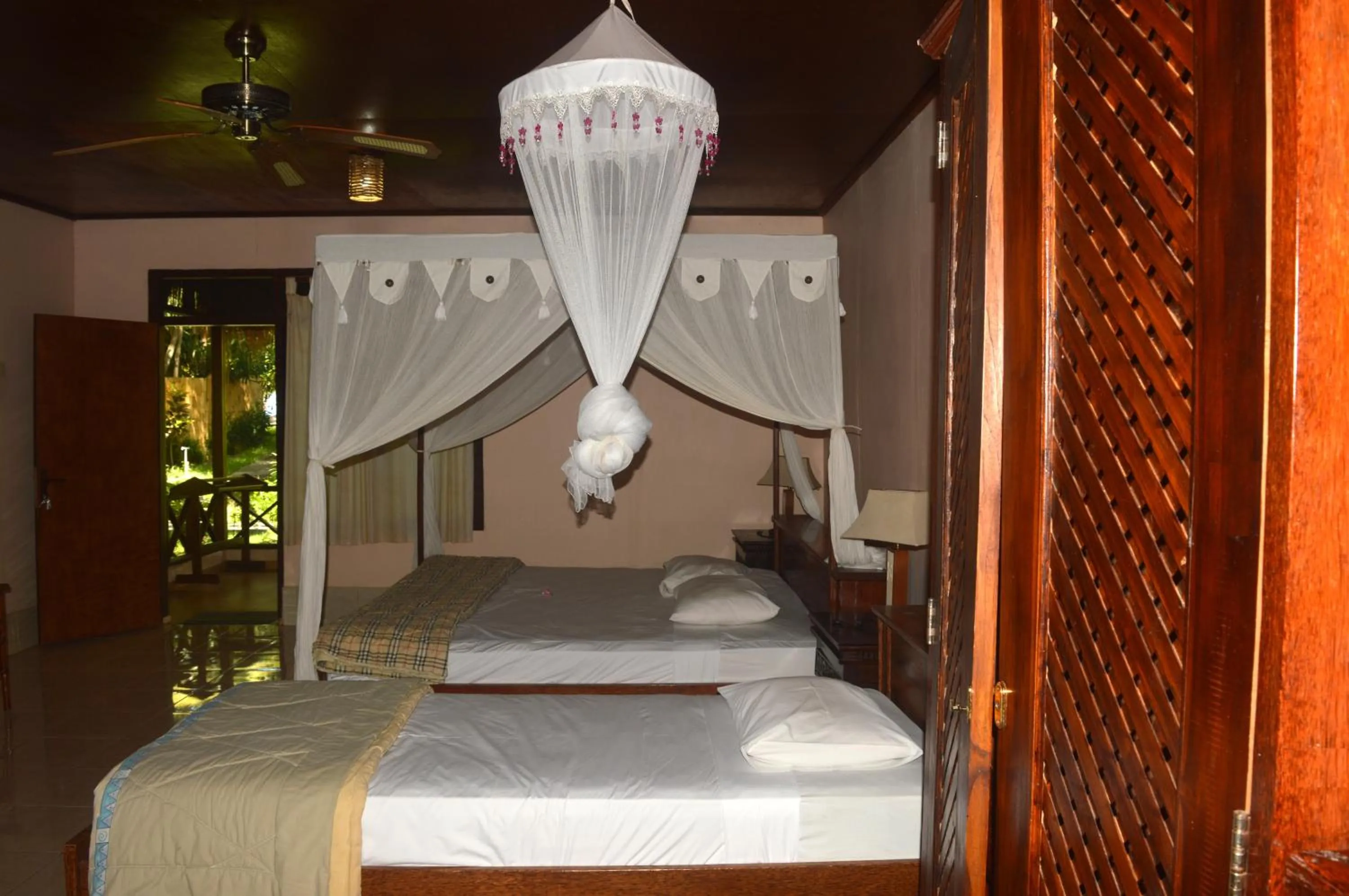 Bed in Sea World Club Beach Resort & Dive Center, RESORT THAT SUPPORTS THE POOR
