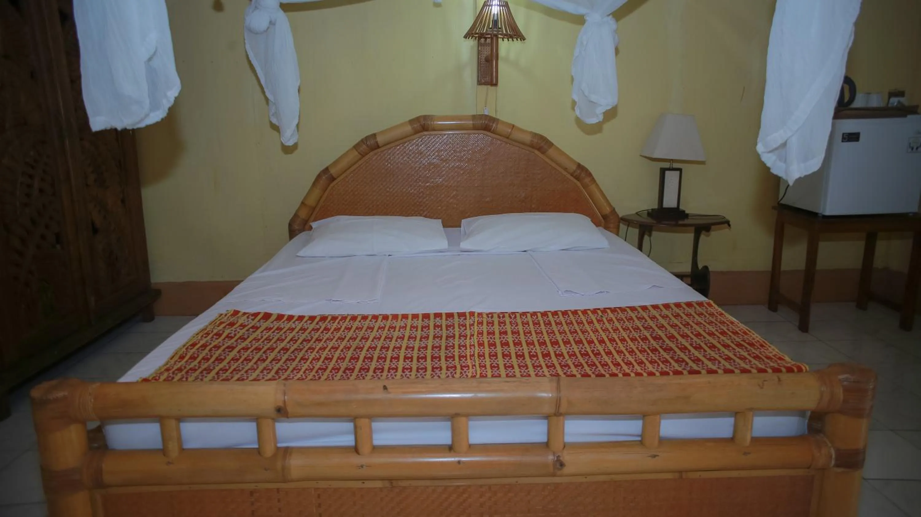 Bed in Sea World Club Beach Resort & Dive Center, RESORT THAT SUPPORTS THE POOR