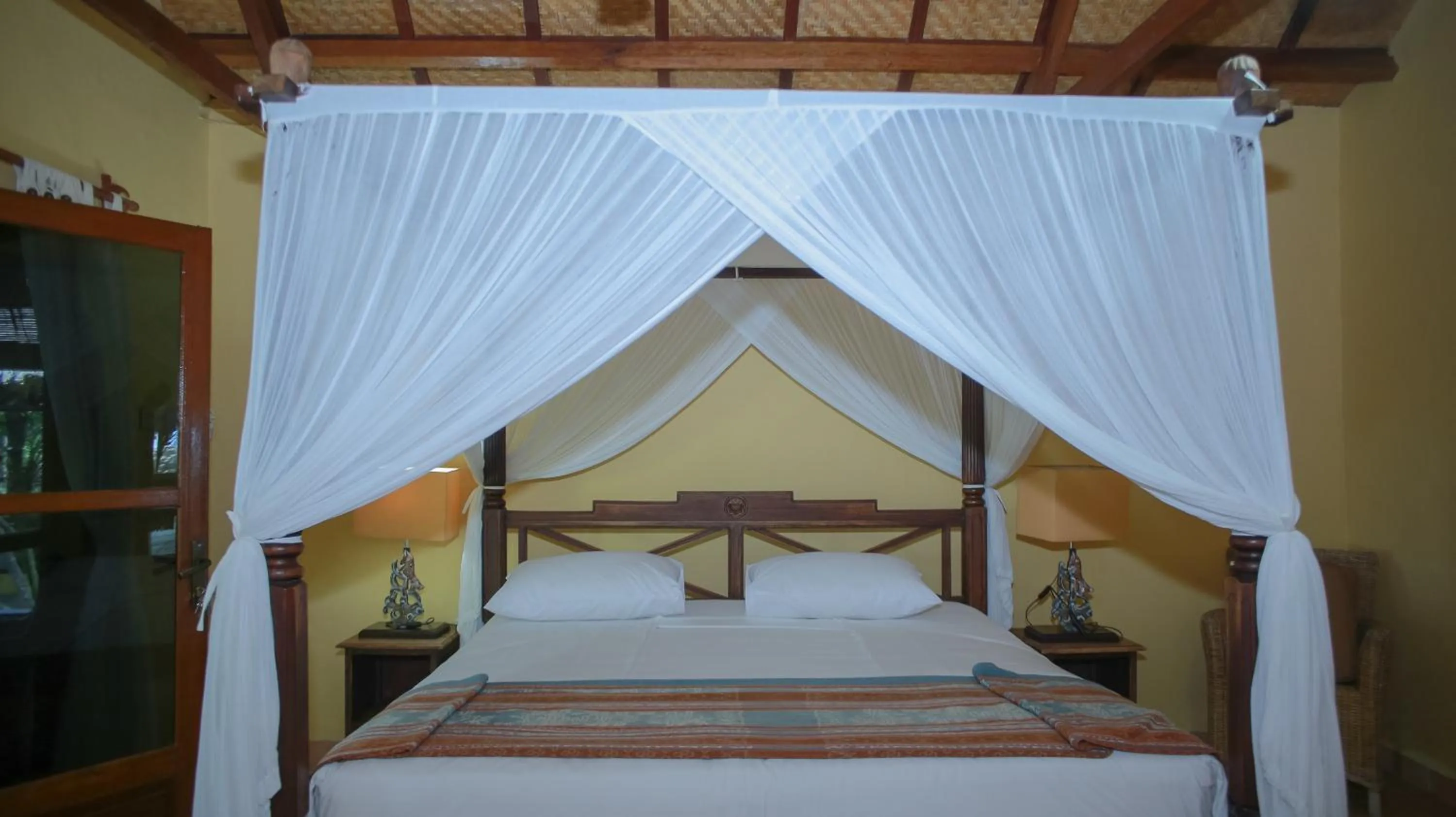 Bed in Sea World Club Beach Resort & Dive Center, RESORT THAT SUPPORTS THE POOR