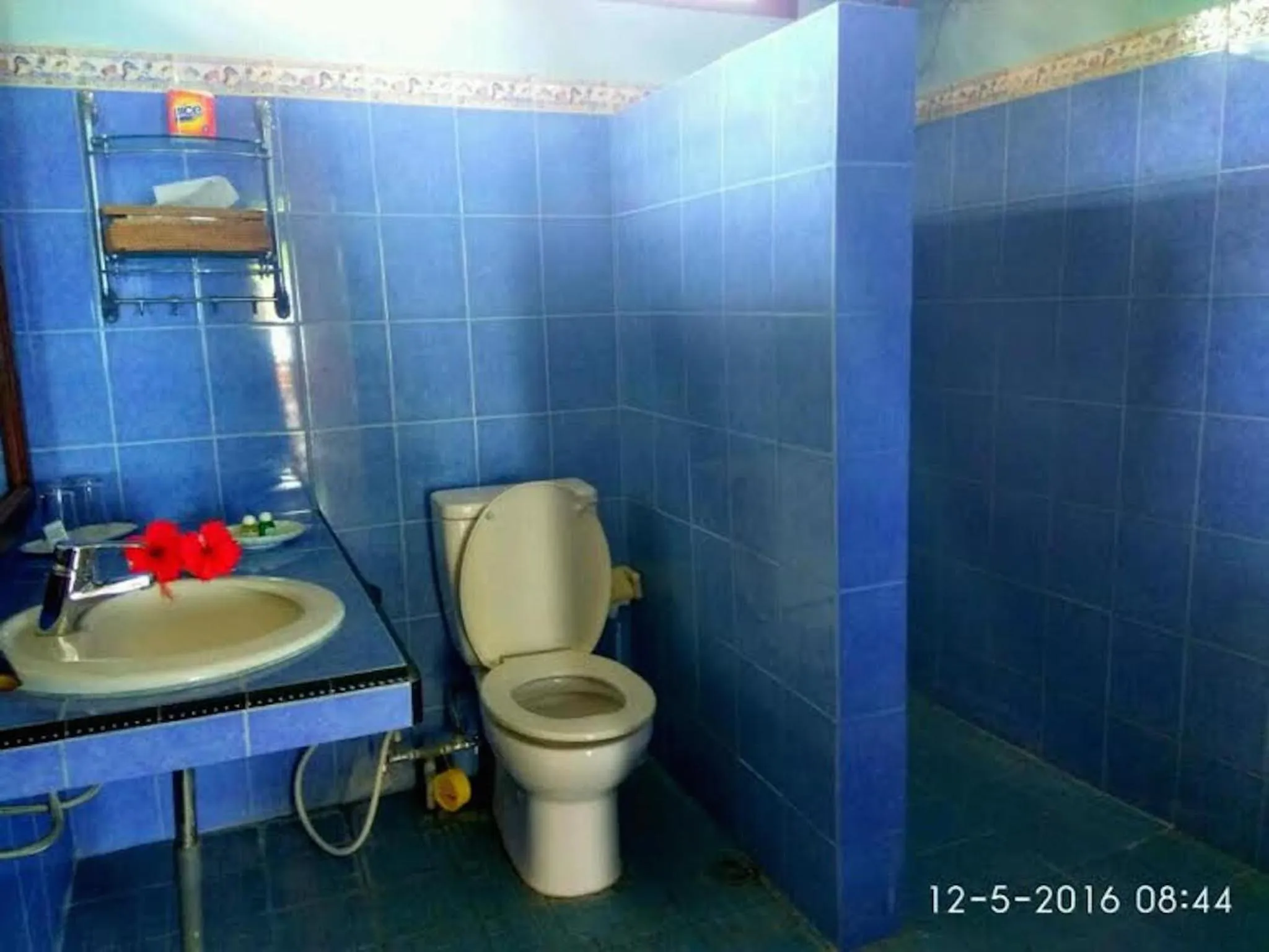 Shower in Sea World Club Beach Resort & Dive Center, RESORT THAT SUPPORTS THE POOR