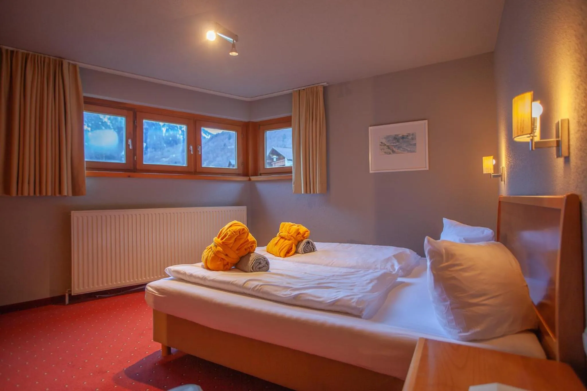 Photo of the whole room, Bed in Walliserhof