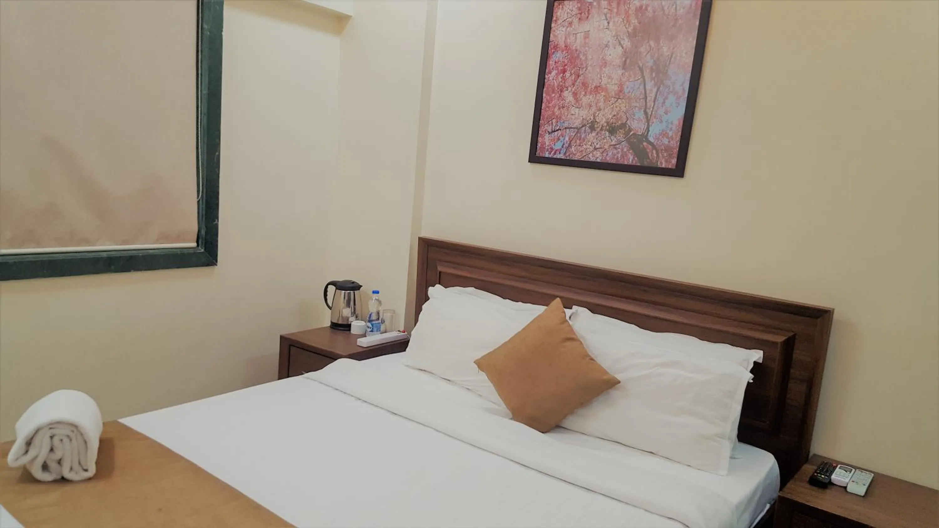 Bed in Dragonfly Apartments Emerald