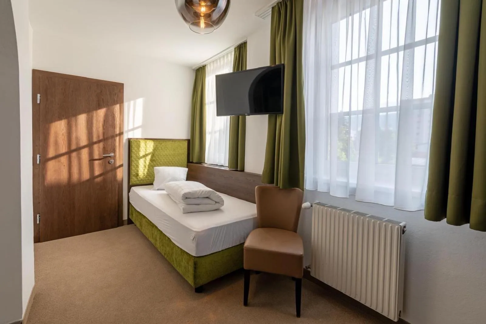 Photo of the whole room, Bed in Hotel Ertl GmbH