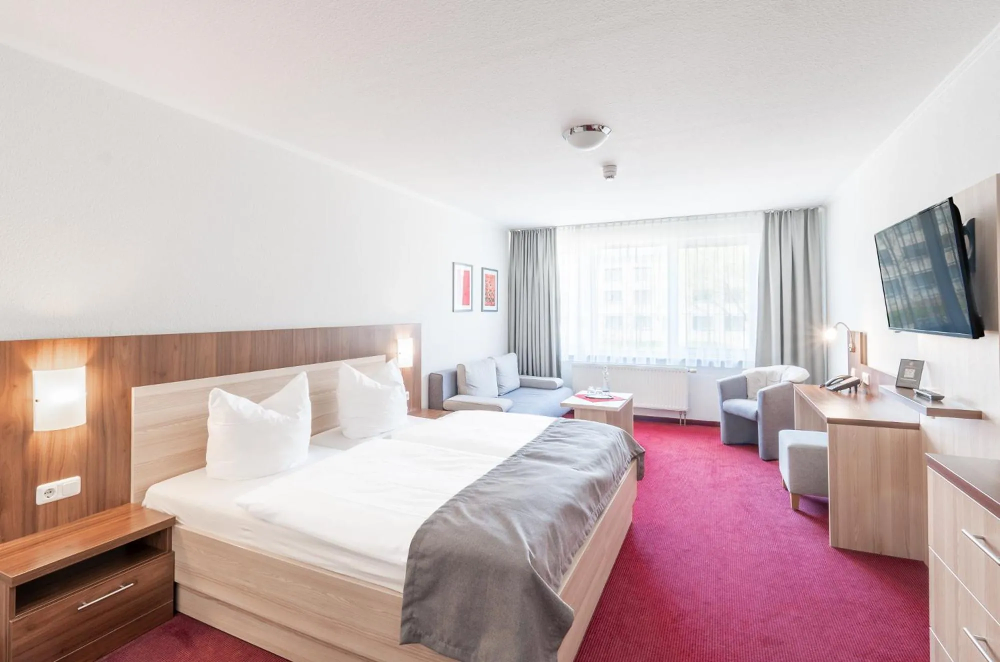 Photo of the whole room, Bed in Sporthotel Neuruppin