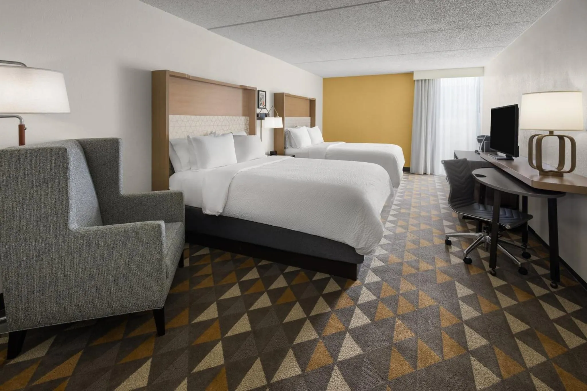 Photo of the whole room, Bed in Holiday Inn Morgantown - Reading Area by IHG
