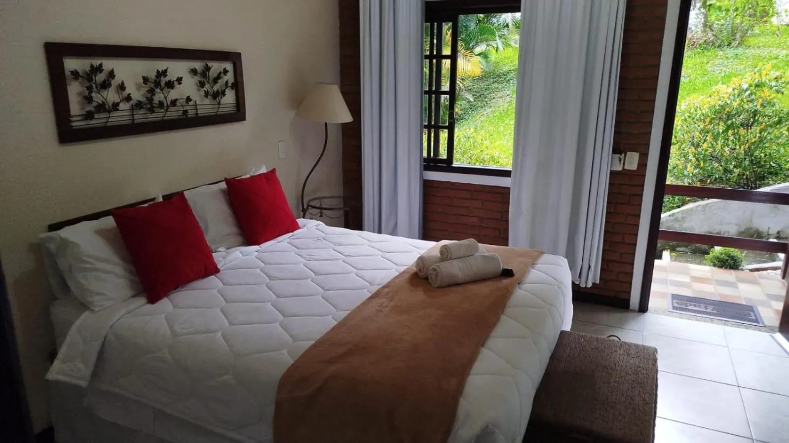 Bed in Pousada Viking Penedo