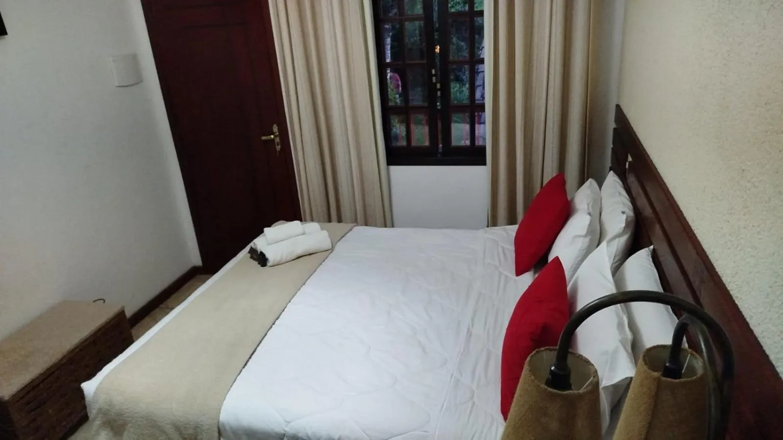 Bed in Pousada Viking Penedo