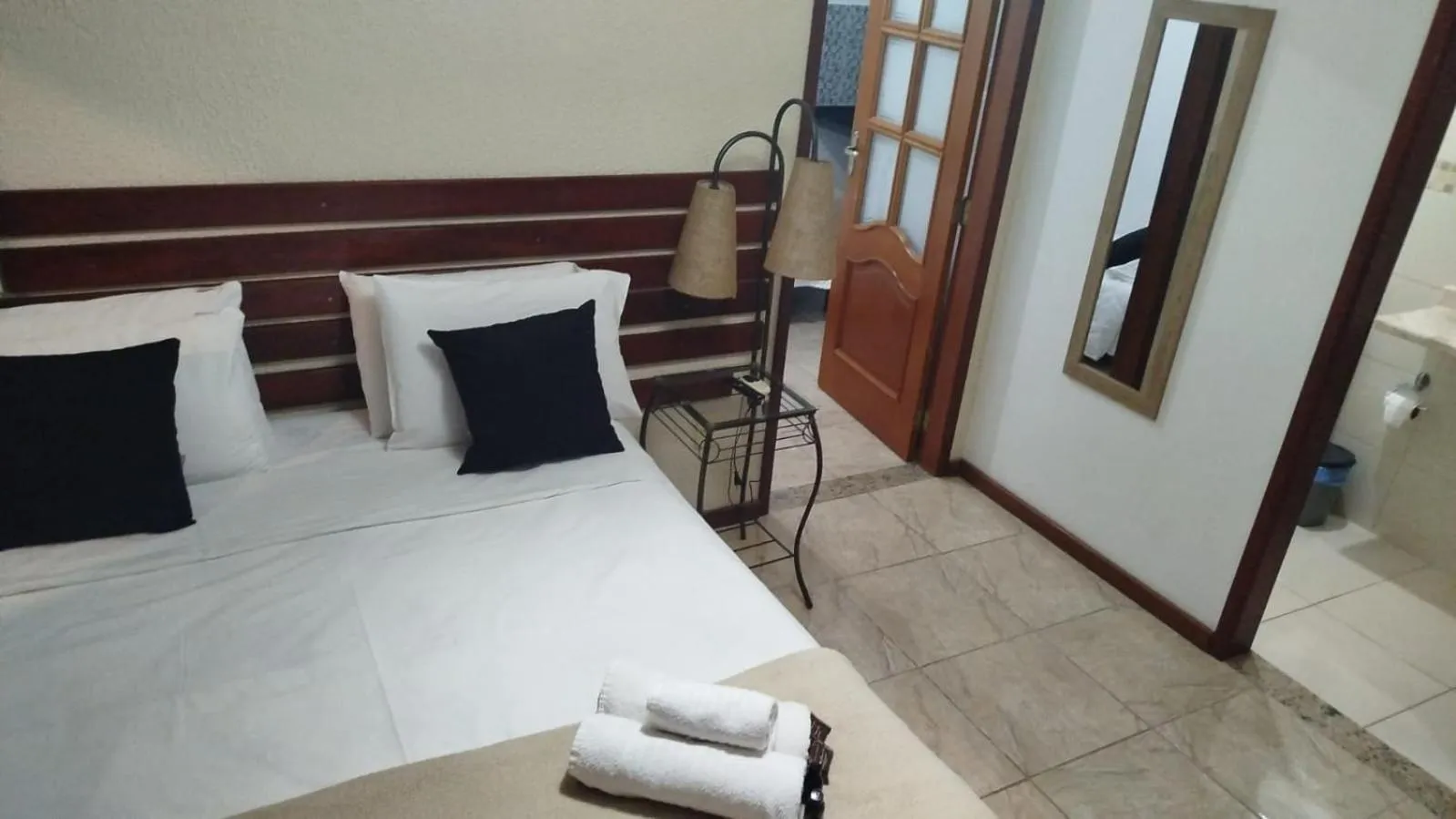 Bed in Pousada Viking Penedo