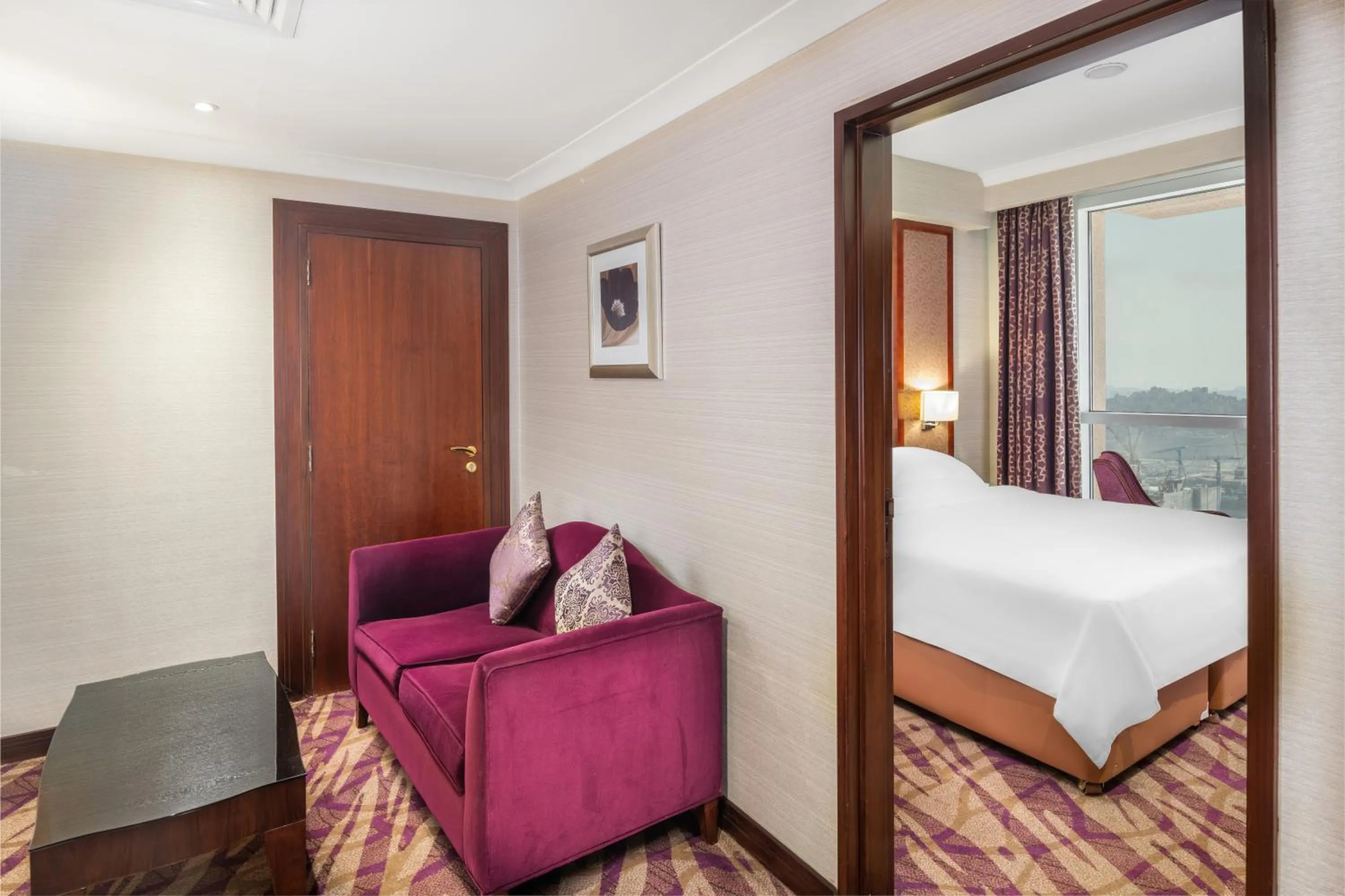 Seating area, Bed in Al Marwa Rayhaan by Rotana - Makkah