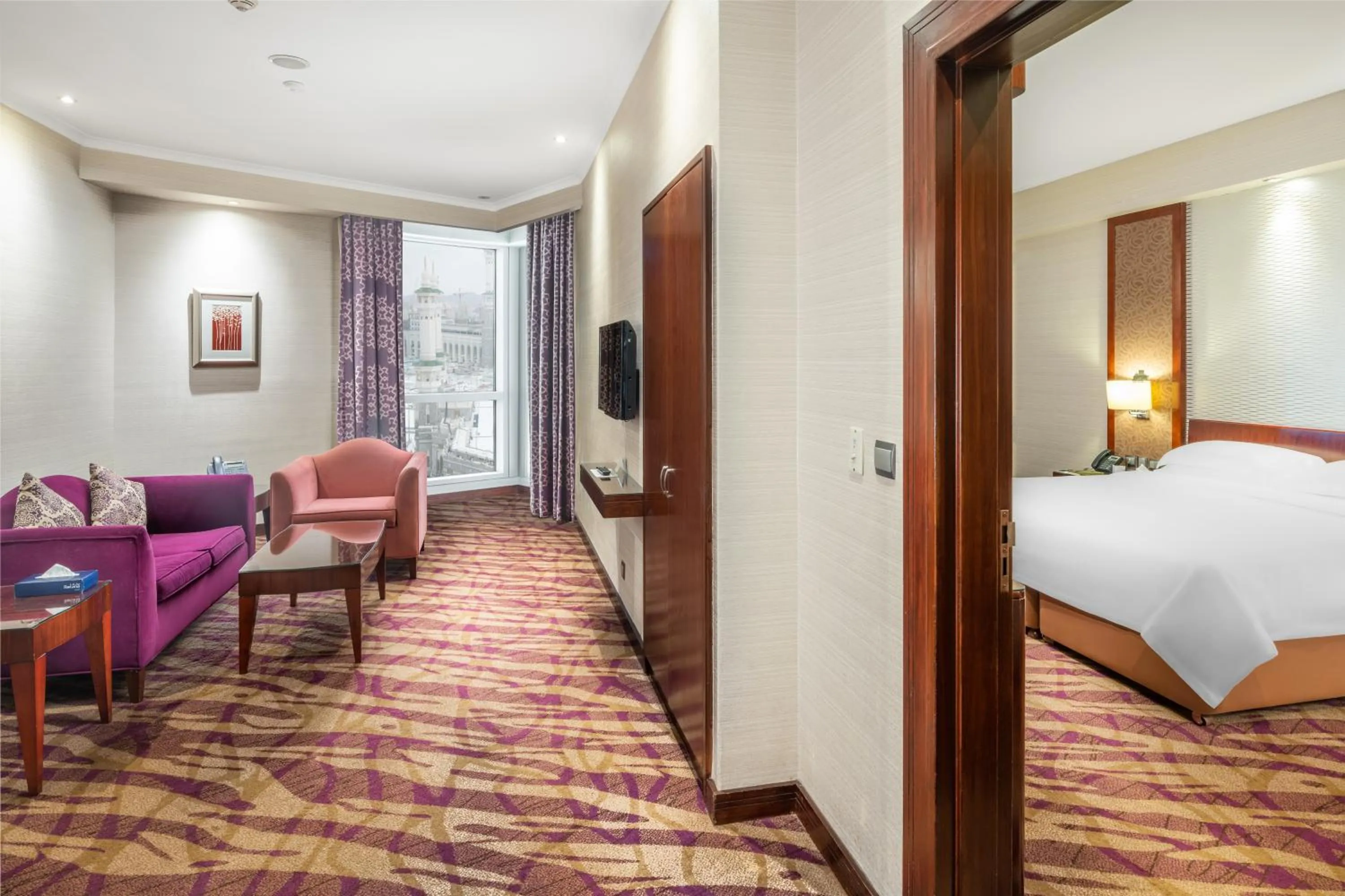 Seating area, Bed in Al Marwa Rayhaan by Rotana - Makkah