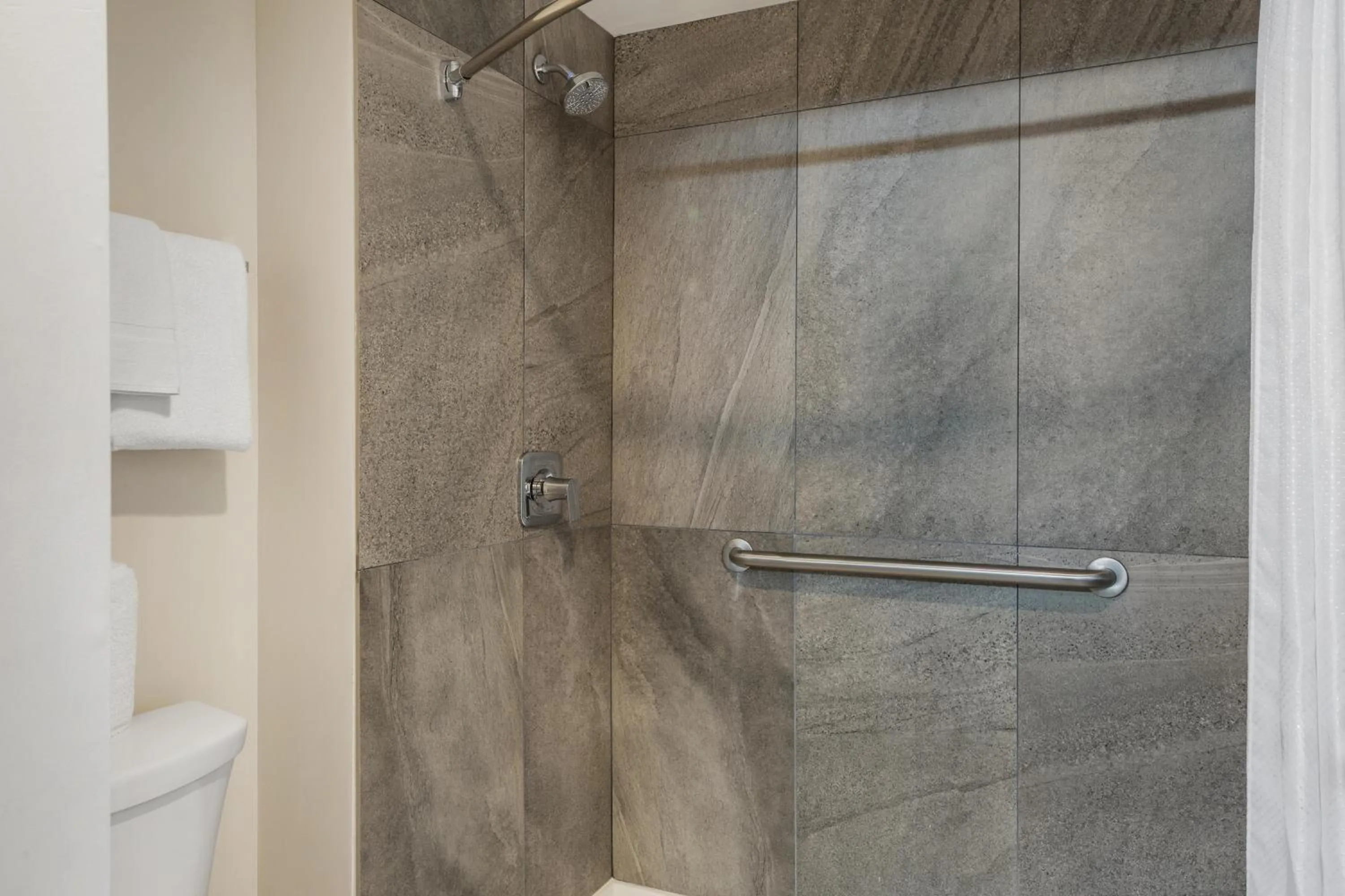 Bathroom in HOM Hotel Gainesville, SureStay Collection by Best Western