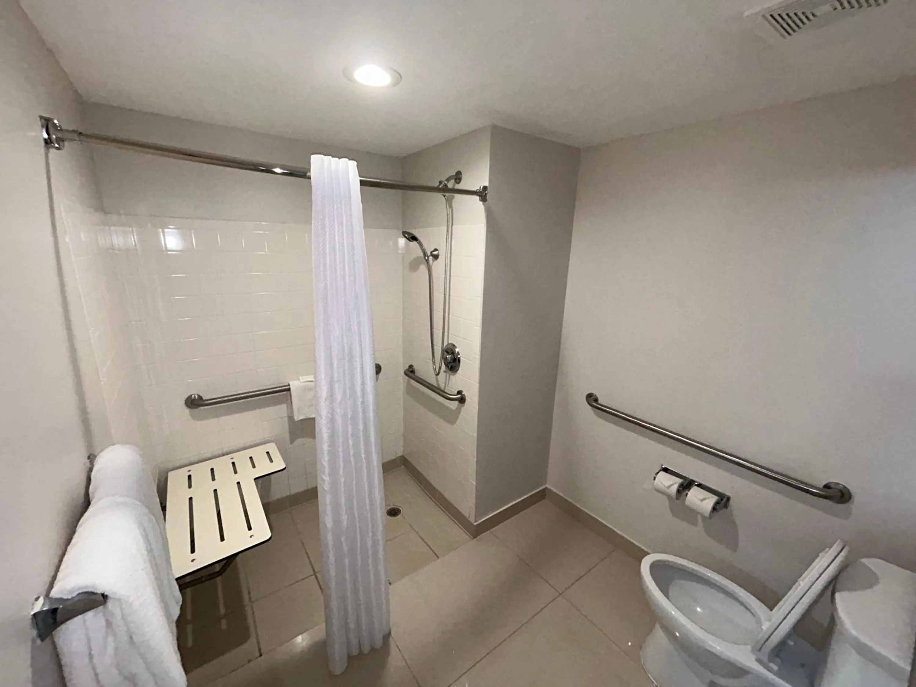 Bathroom in HOM Hotel Gainesville, SureStay Collection by Best Western