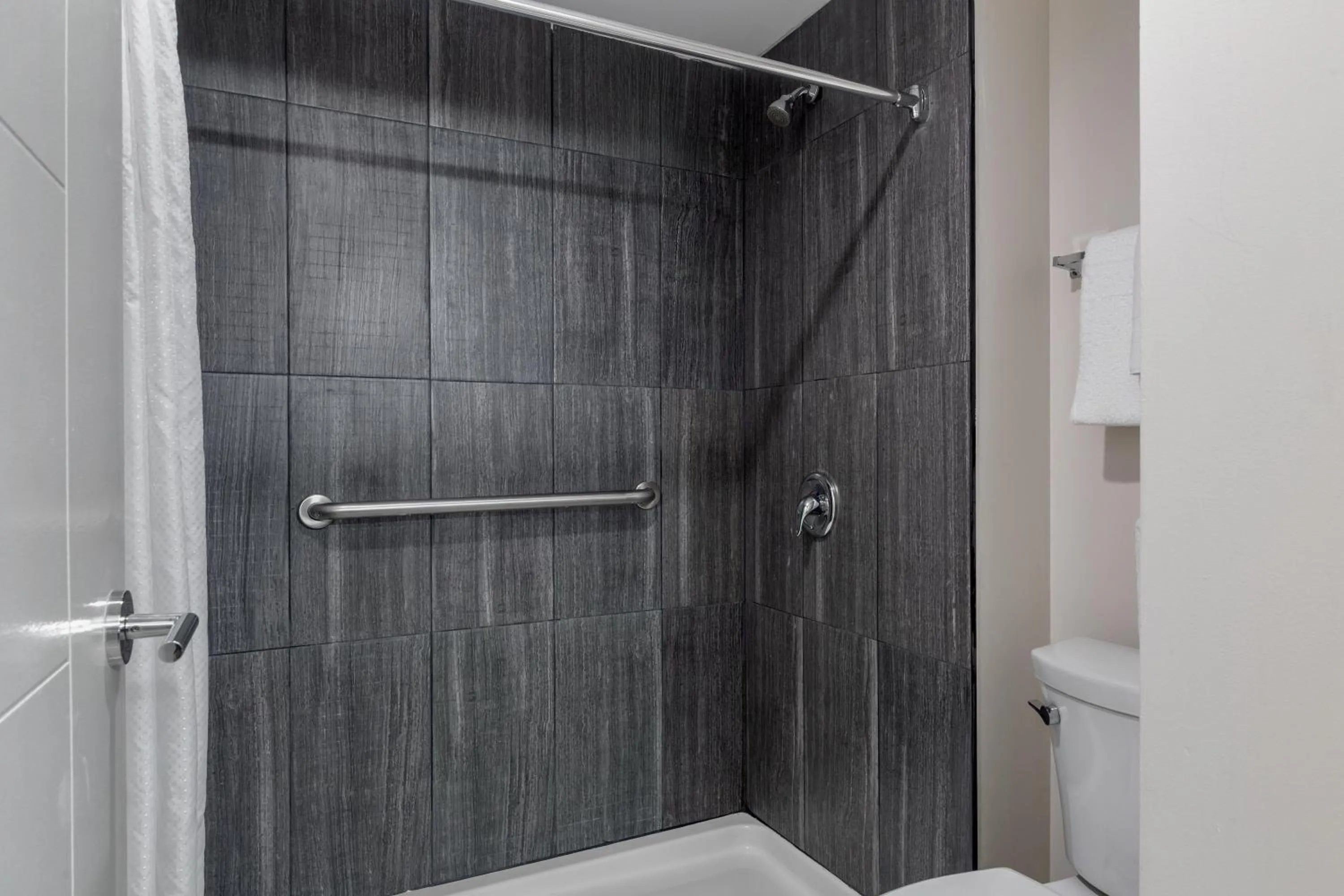 Bathroom in HOM Hotel Gainesville, SureStay Collection by Best Western