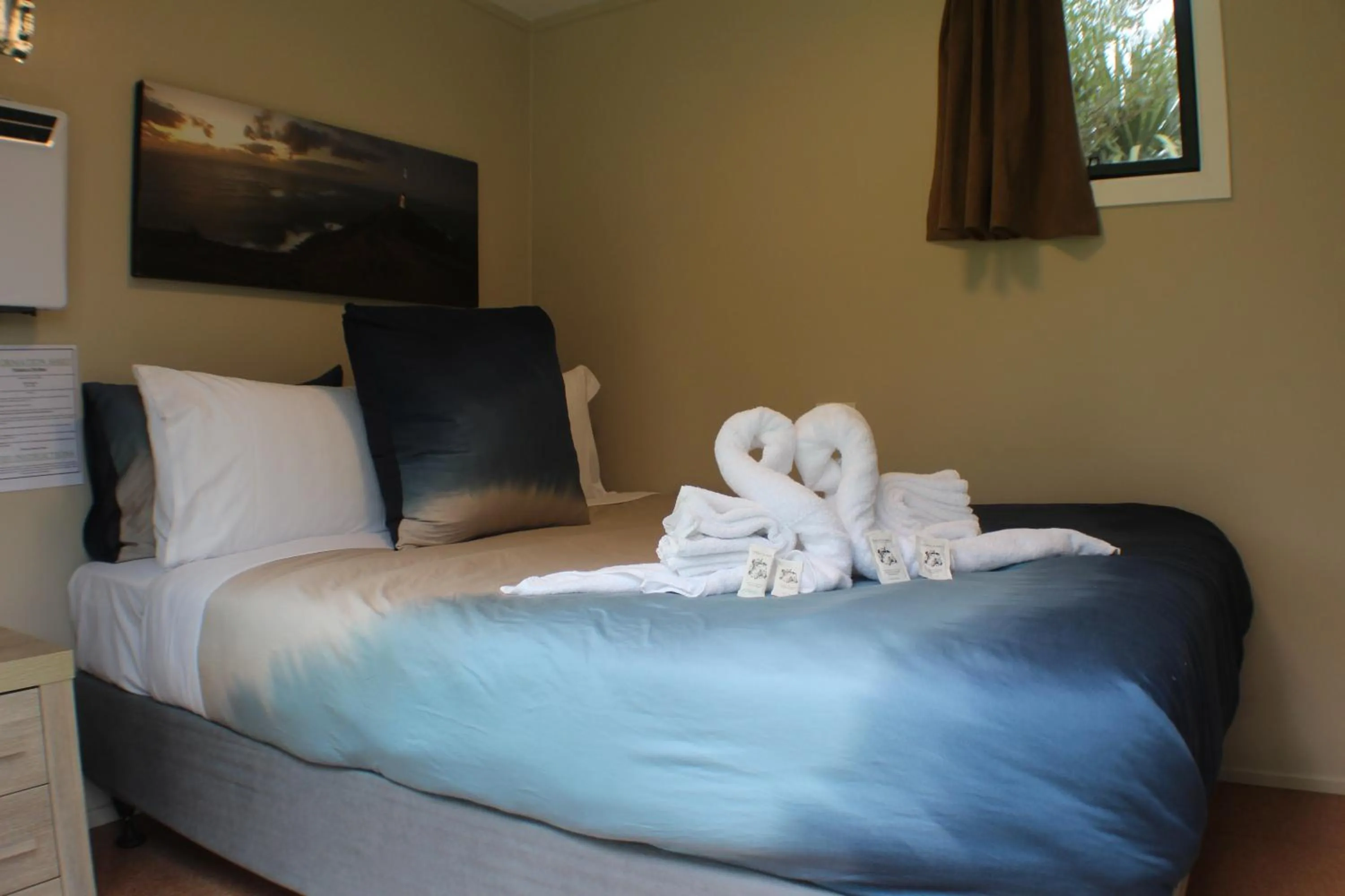 Photo of the whole room, Bed in The Barn Cabins & Camp