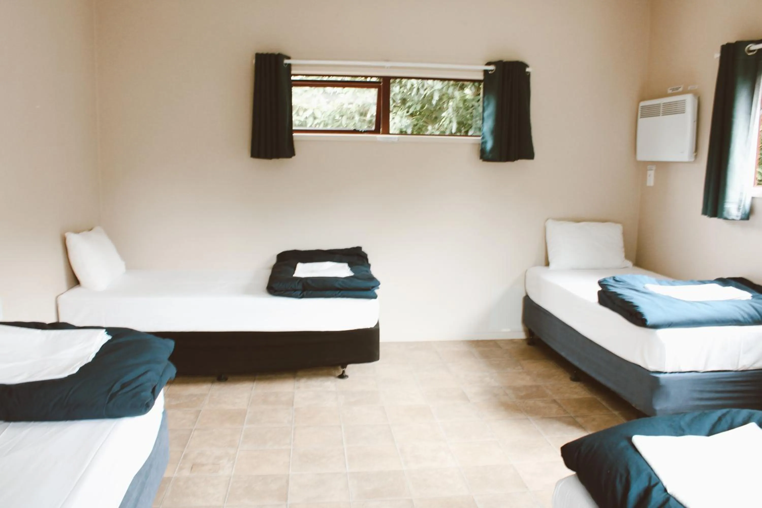 Bed in The Barn Cabins & Camp