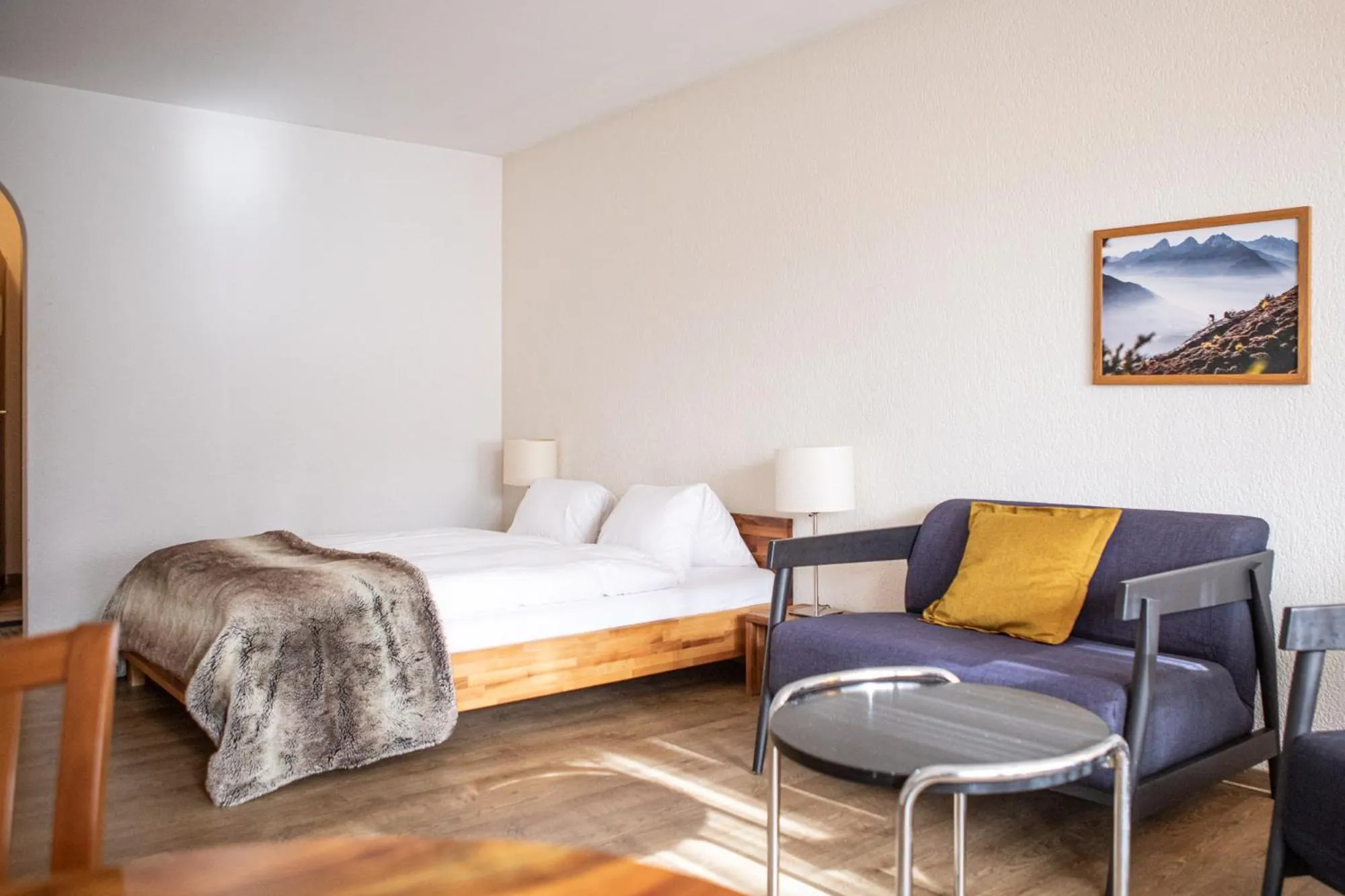 Seating area, Bed in Kurhaus Lenzerheide