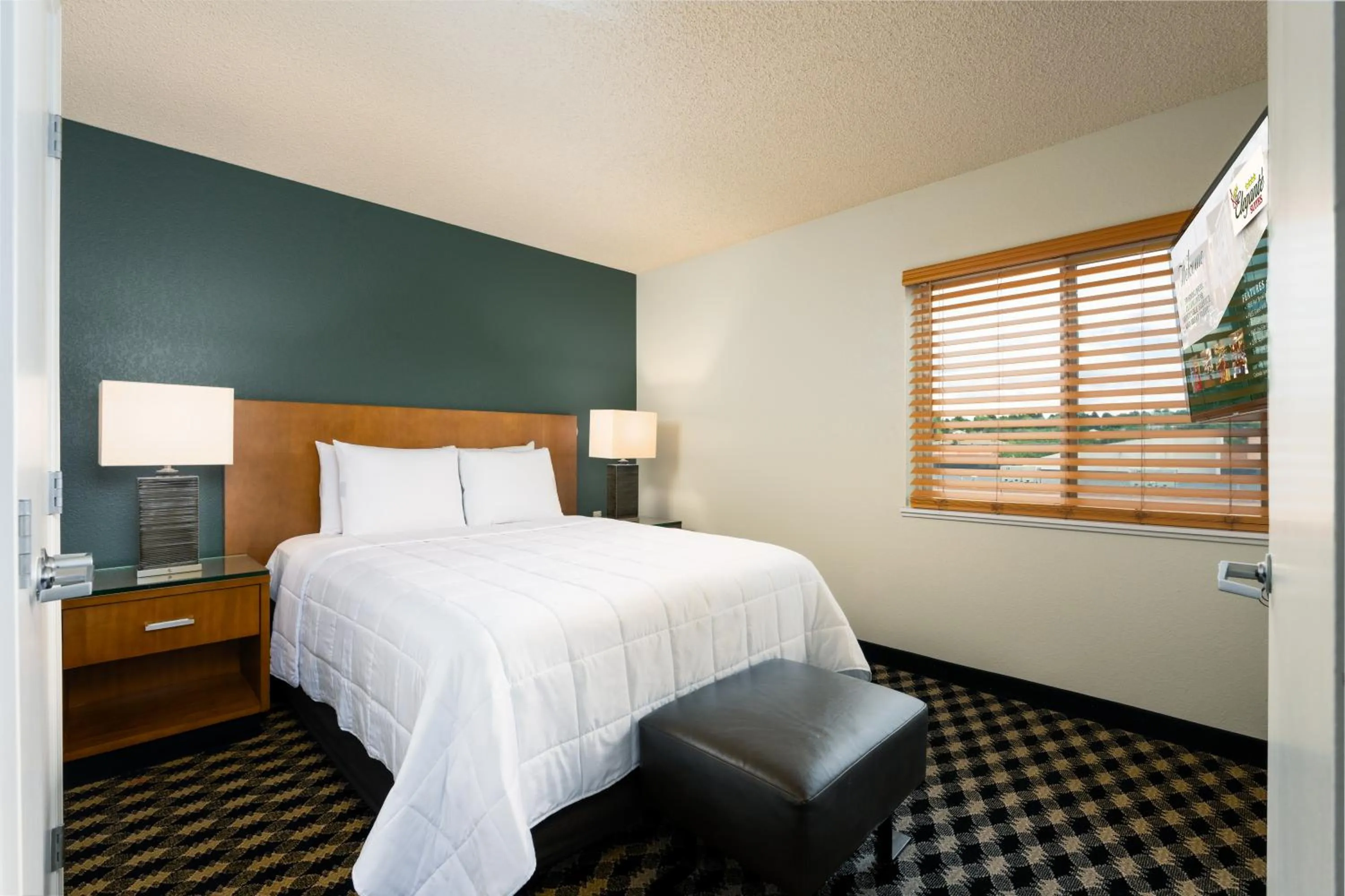 Bed in MCM Elegante Suites