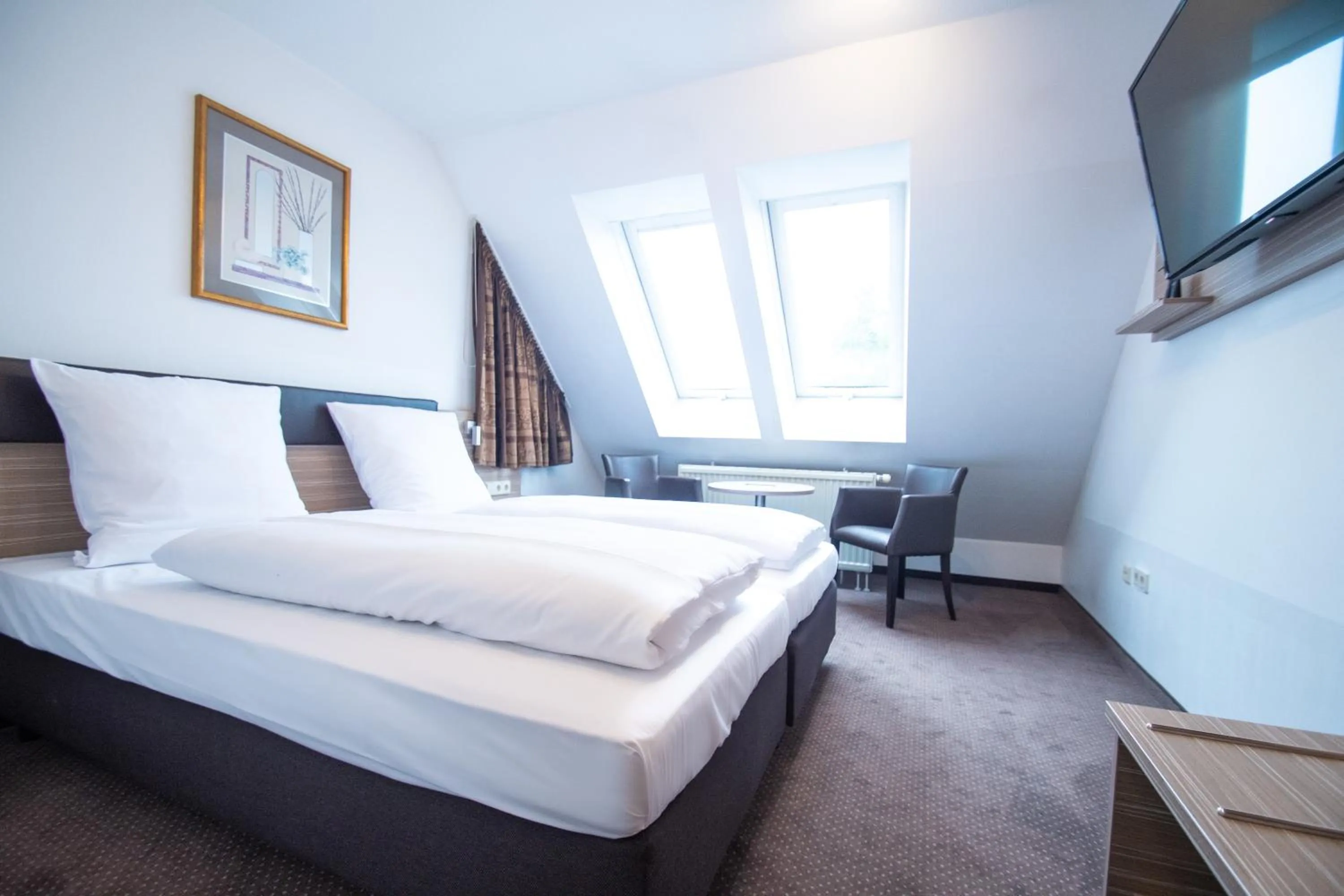 Photo of the whole room, Bed in Taste Smart Hotel Backnang