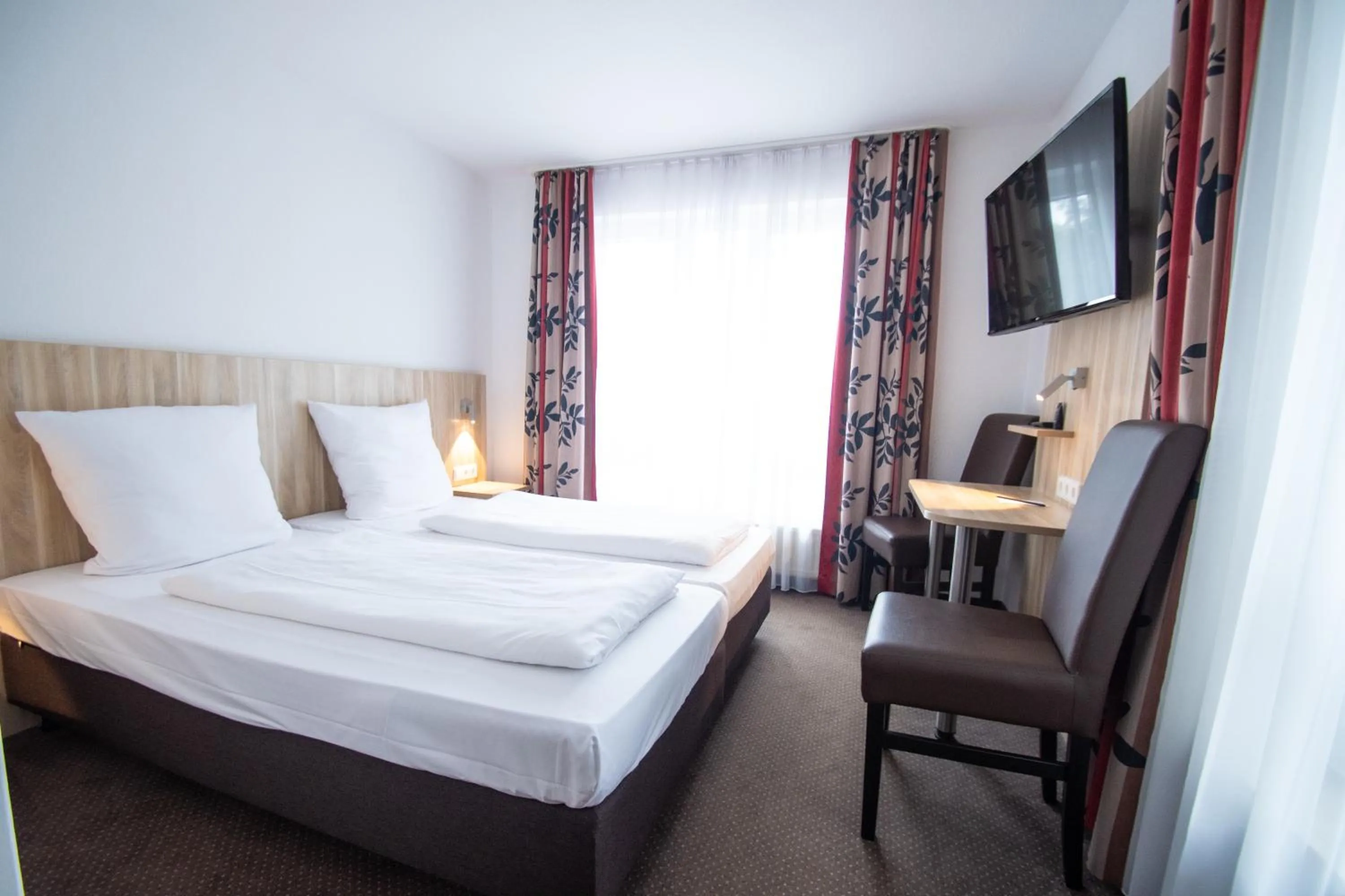 Photo of the whole room, Bed in Taste Smart Hotel Backnang