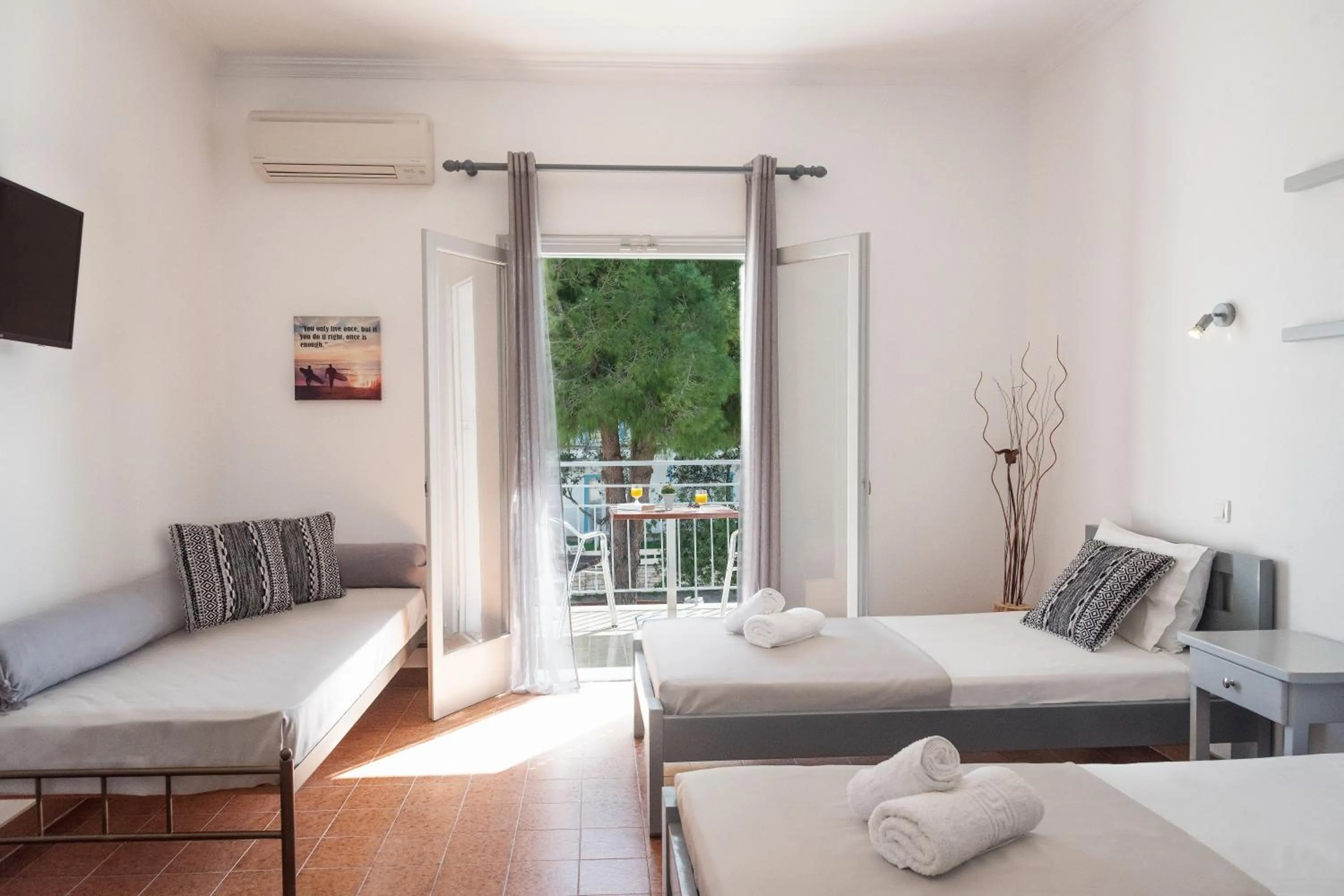 Photo of the whole room, Bed in Three Seasons