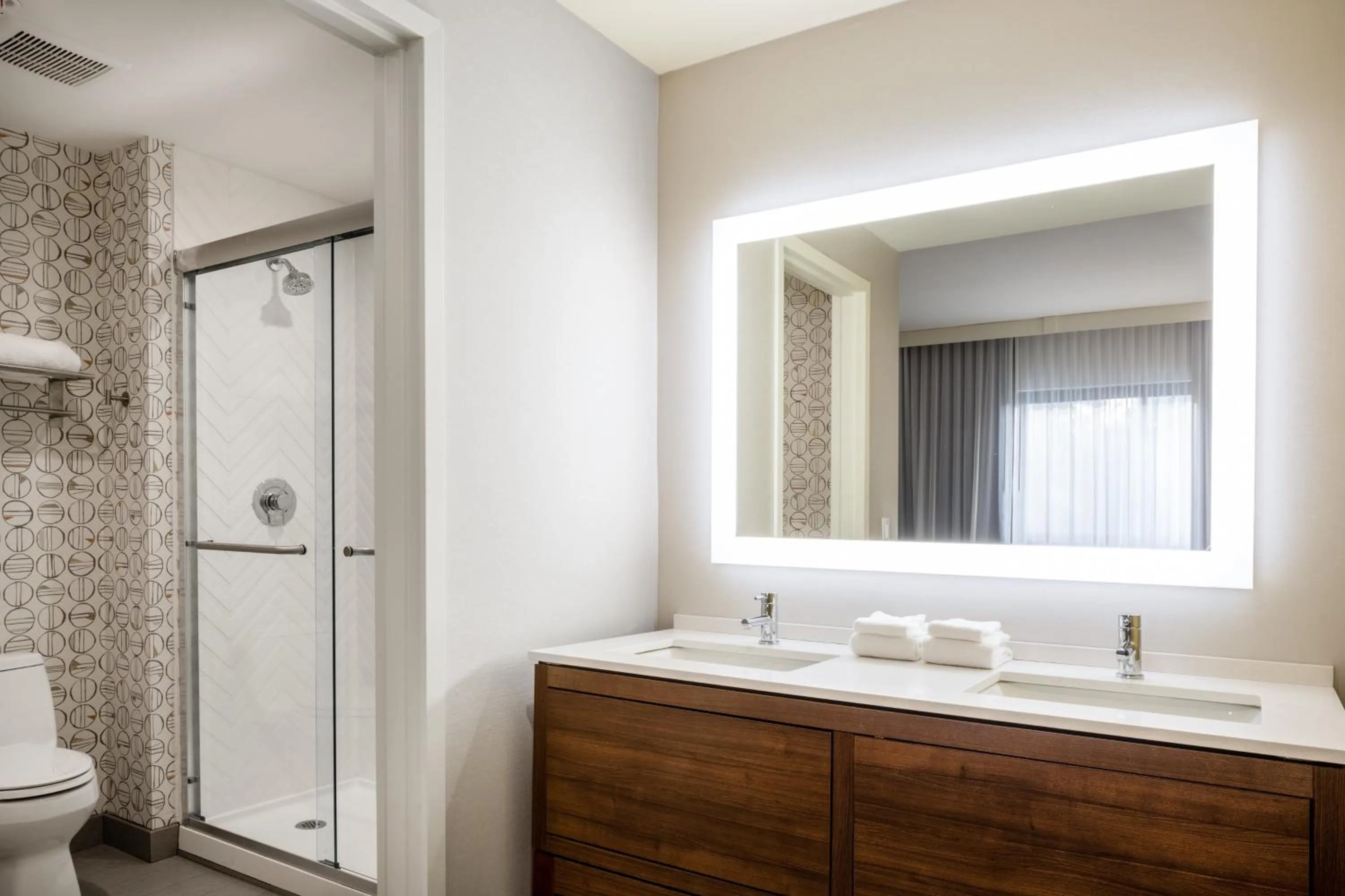 Bathroom in Holiday Inn - Long Island - ISLIP Arpt East by IHG