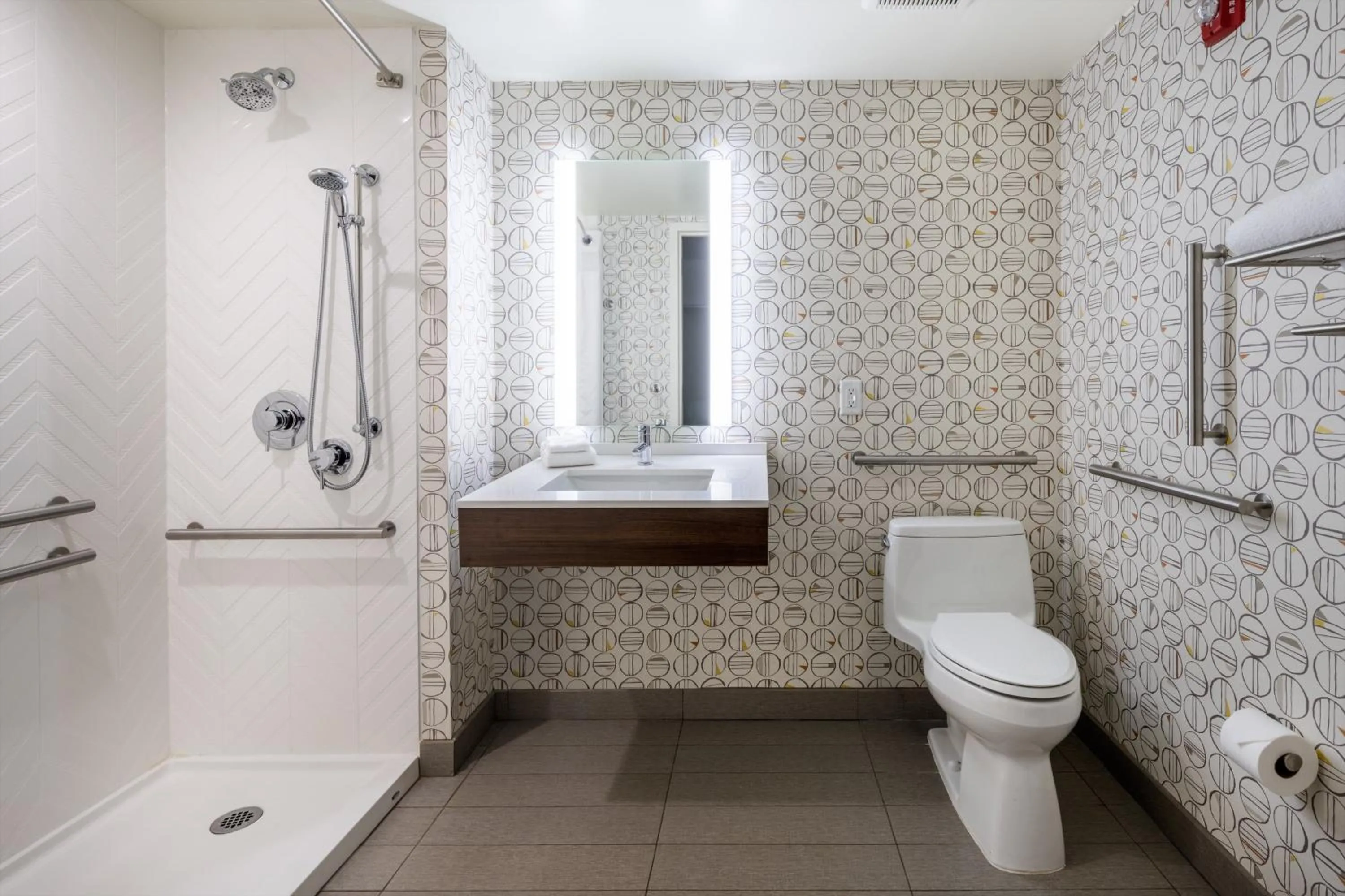 Bathroom in Holiday Inn - Long Island - ISLIP Arpt East by IHG