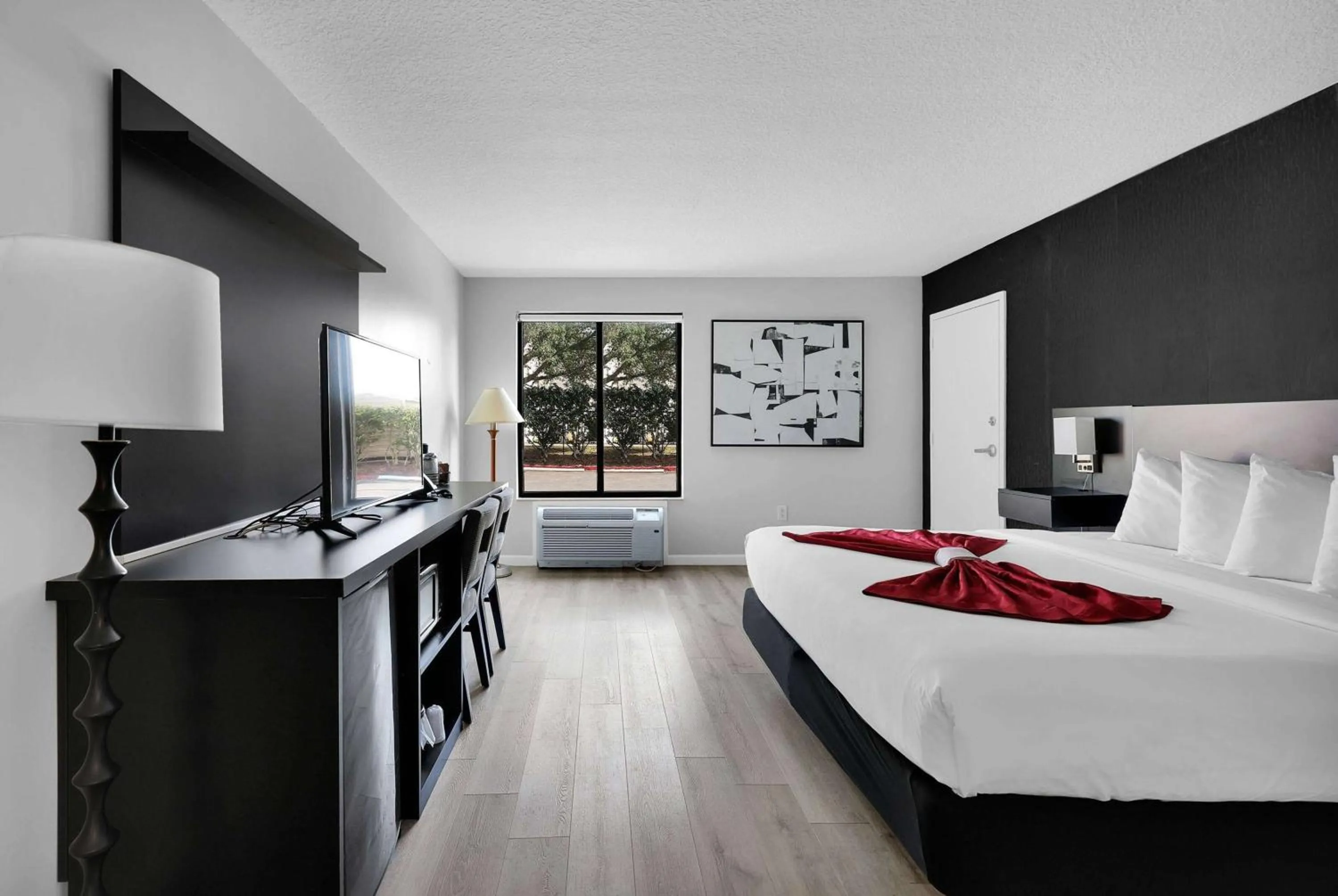 Photo of the whole room, Bed in Ramada by Wyndham Jacksonville I-95 by Butler Blvd