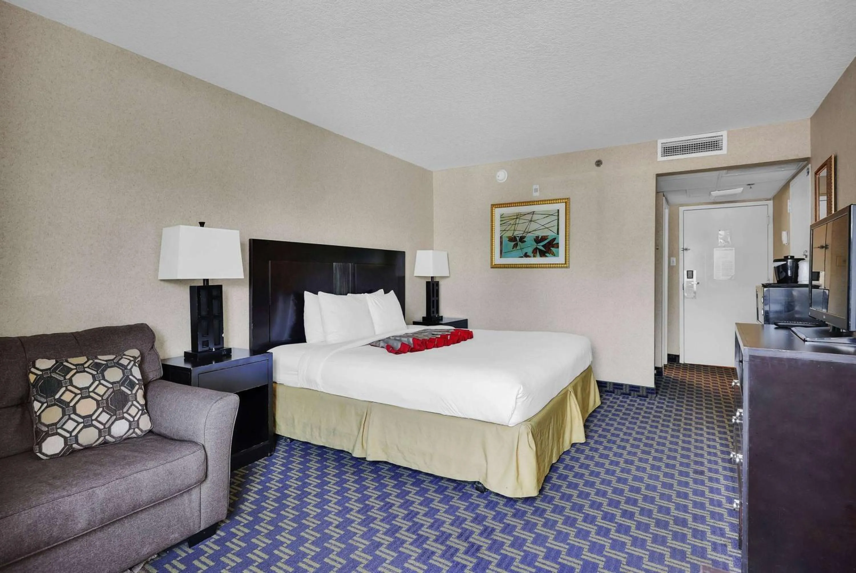 Photo of the whole room, Bed in Ramada by Wyndham Jacksonville I-95 by Butler Blvd