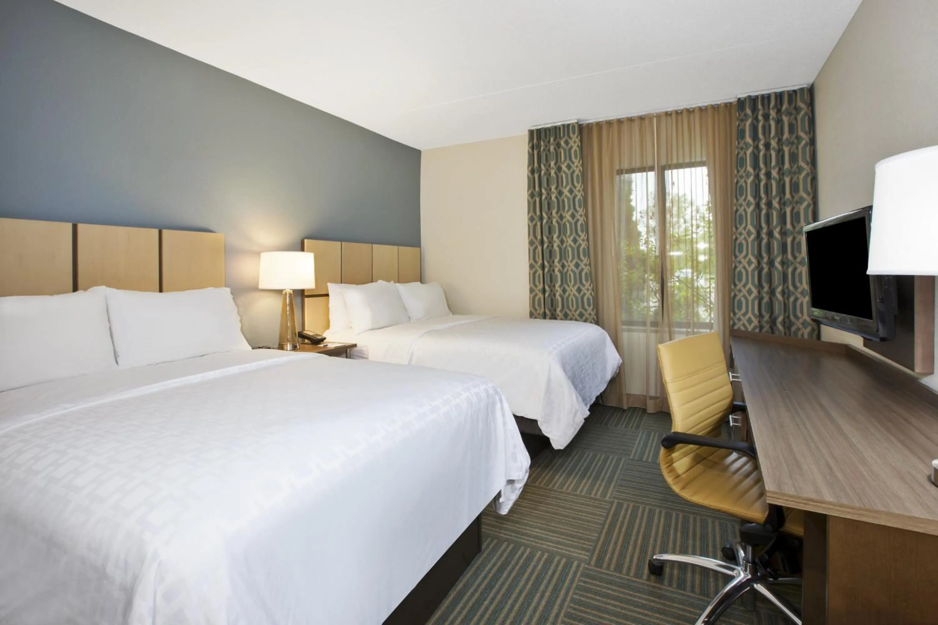 Photo of the whole room, Bed in Candlewood Suites Grand Rapids Airport by IHG