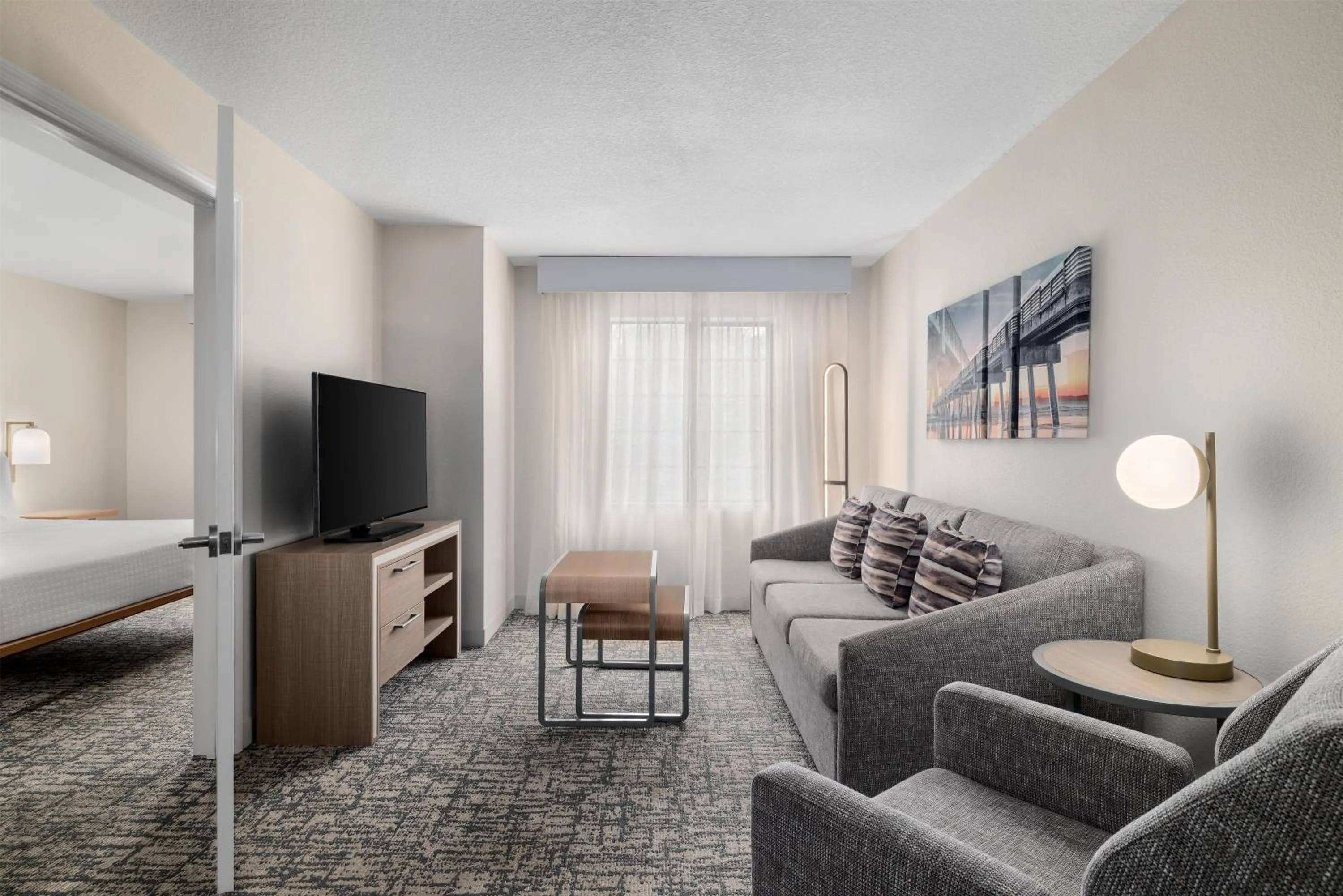 Living room, Bed in Homewood Suites Jacksonville Deerwood Park