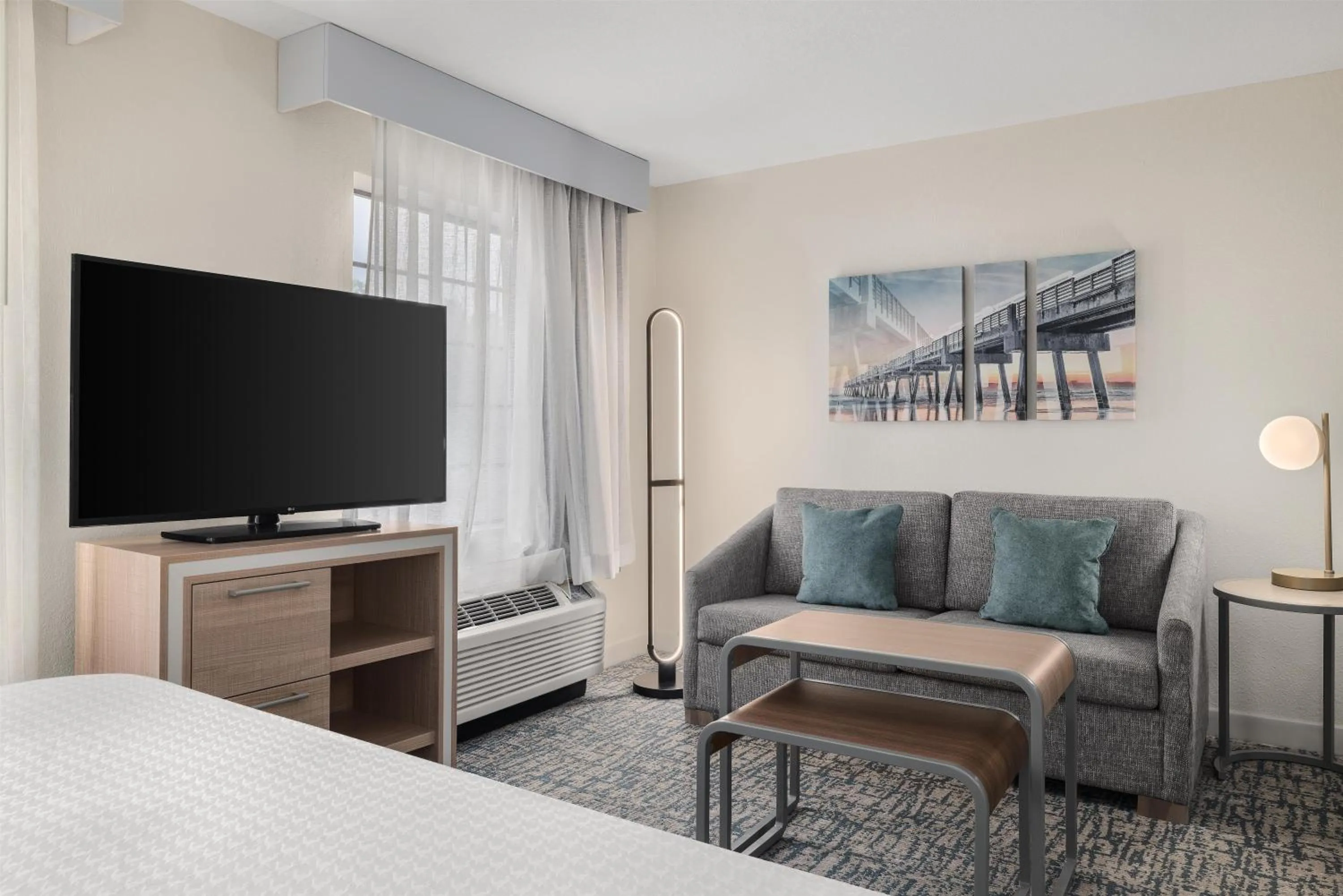 Living room, Bed in Homewood Suites Jacksonville Deerwood Park