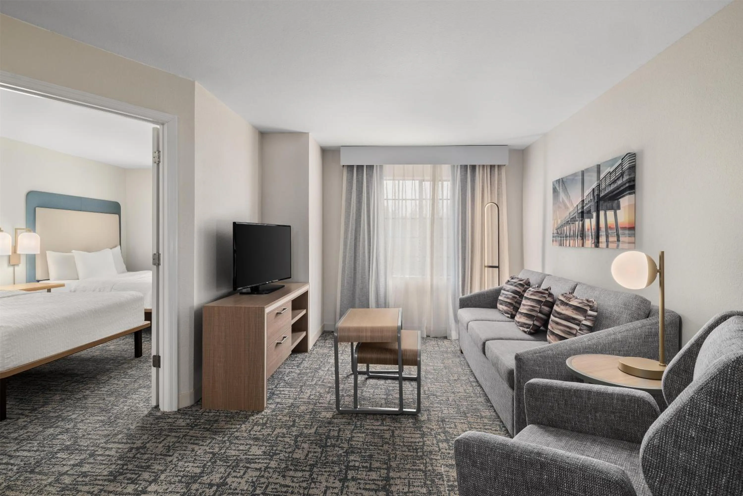 Living room, Bed in Homewood Suites Jacksonville Deerwood Park