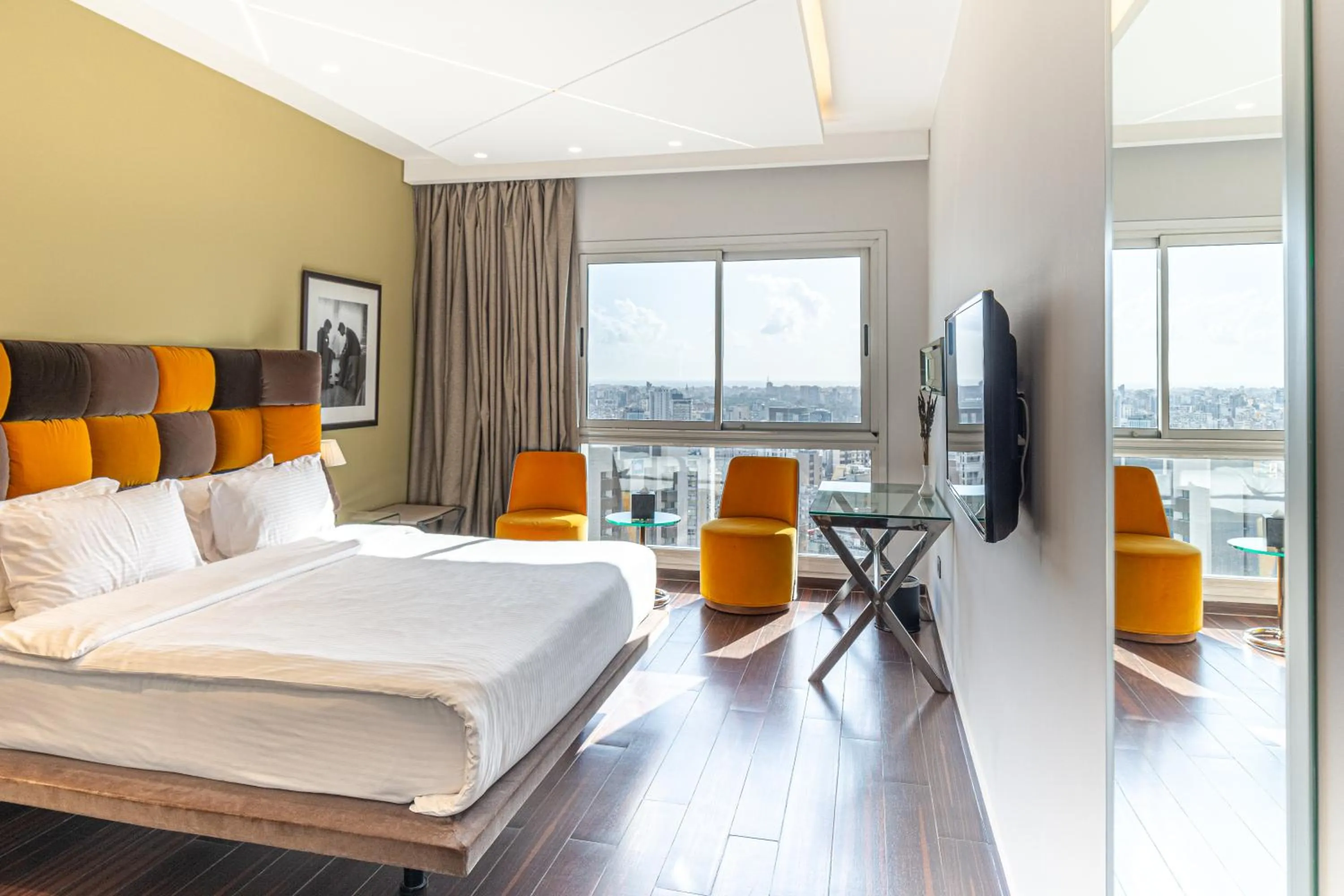 Communal lounge/ TV room, Bed in Royal Tulip Achrafieh