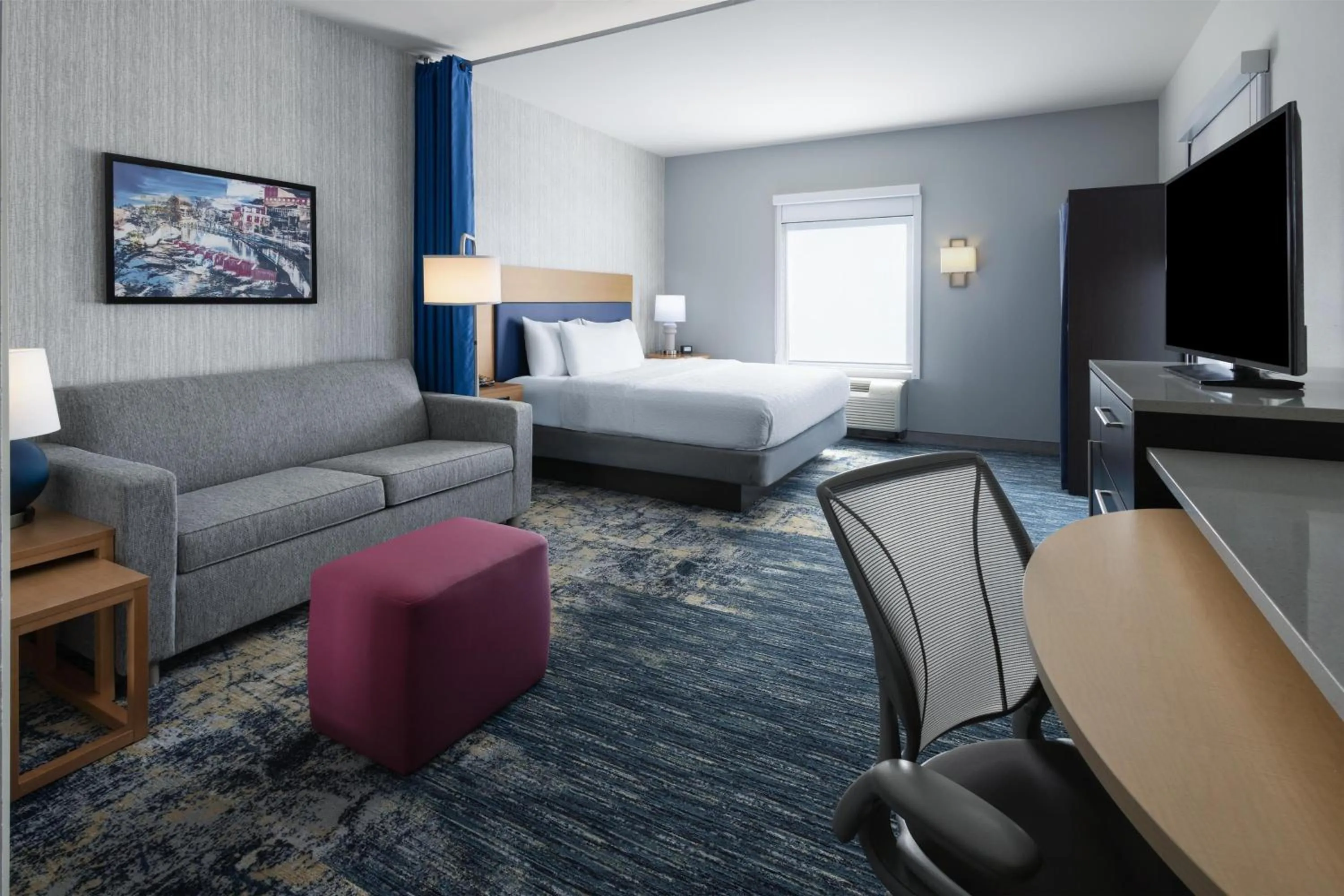 Living room, Bed in Home2 Suites by Hilton Greenville Downtown