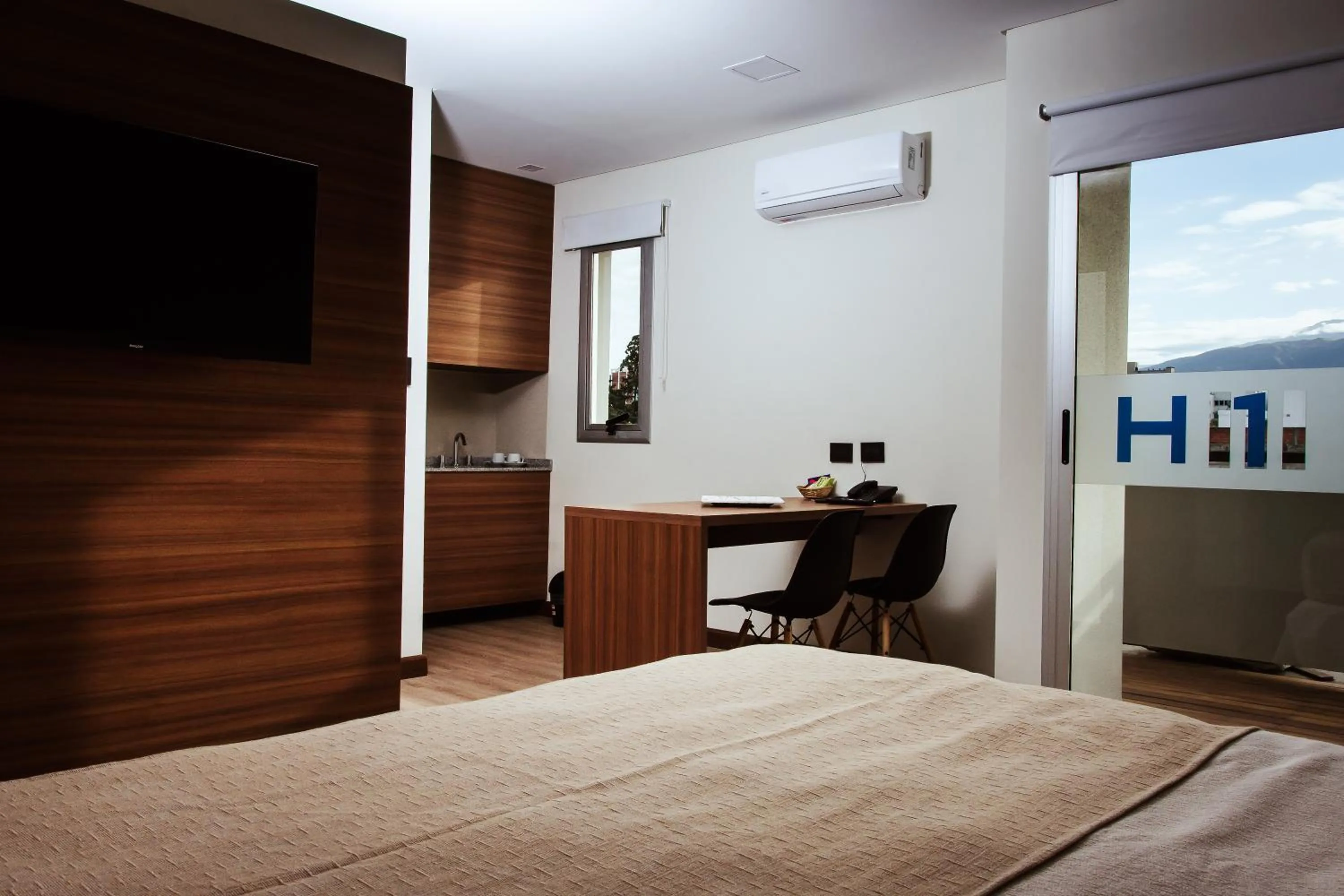 Bed in H1 Apartments Hotel